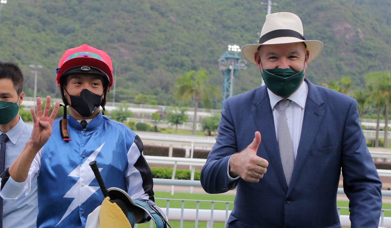Jockey Vincent Ho and trainer David Hayes celebrate Naboo Attack’s win.