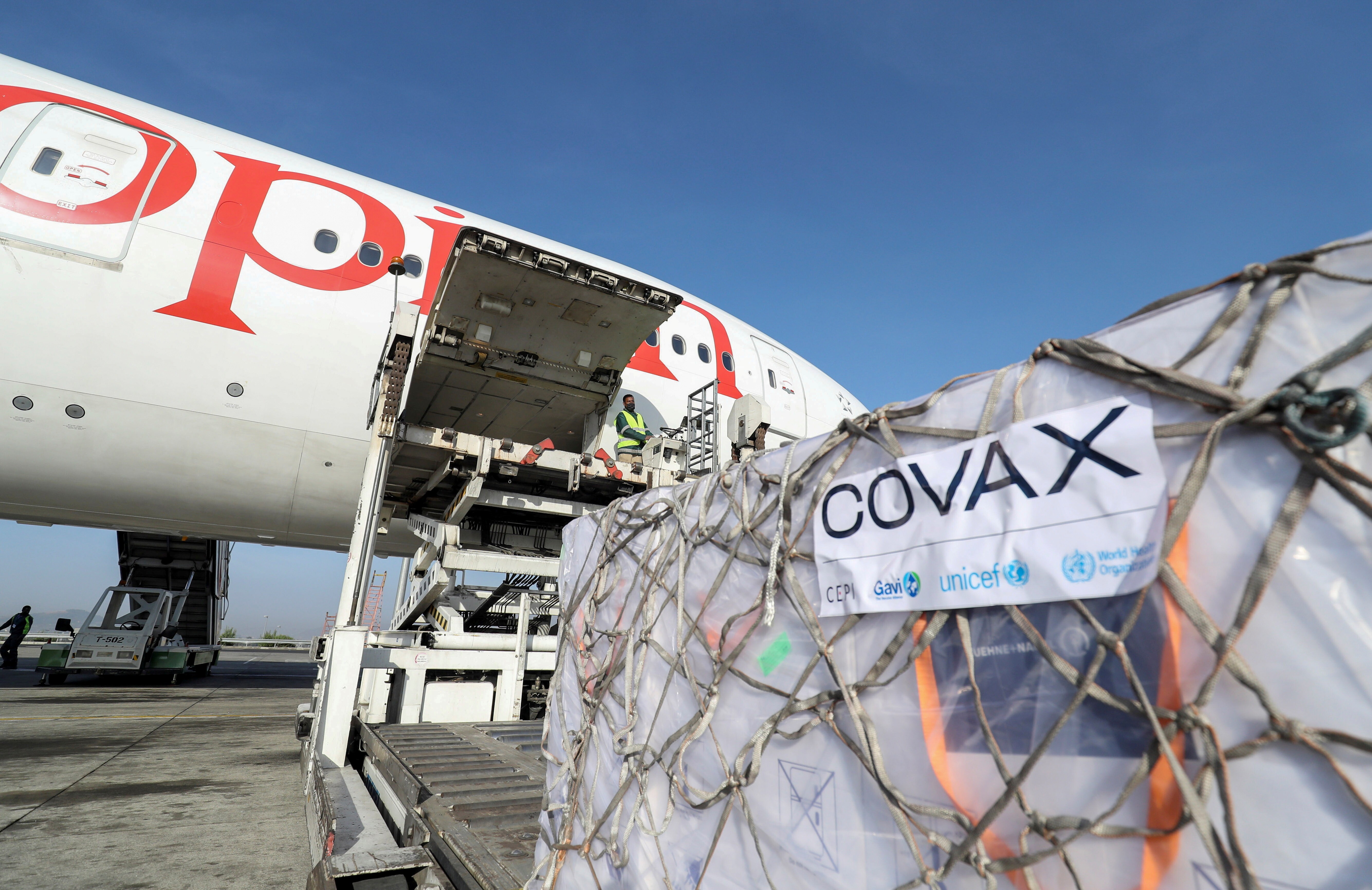 Ethiopian Airlines staff unload AstraZeneca vaccines from a cargo plane at Bole International Airport in Addis Ababa, Ethiopia, on March 7. As rich countries hoard vaccines, the Covax programme has only distributed 77 million doses to some of the world’s poorest people so far. Photo: Reuters