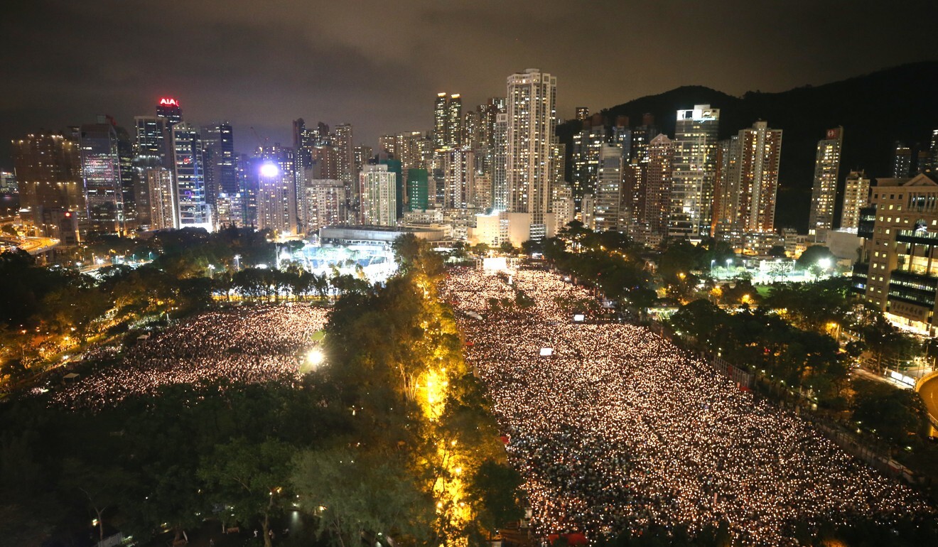 Thousand of Hongkongers raise their candles during the June 4 vigil at Victoria Park in 2019. Photo: Winson Wong