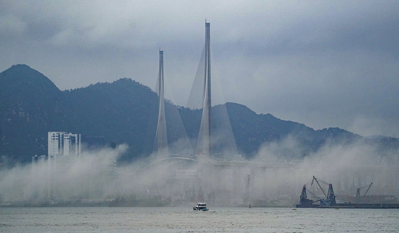 Smoke from the fire spreads across Victoria Harbour on Wednesday. Photo: Felix Wong