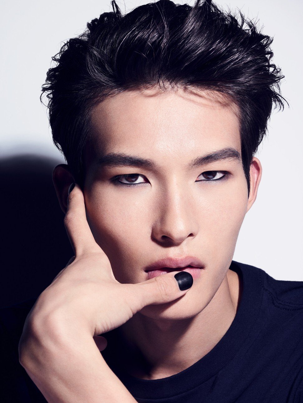 A model wears Boy de Chanel nail polish.