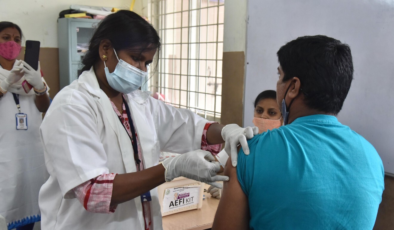 A health worker administers a dose of Covid-19 vaccine to a man in Hyderabad, India, on Thursday. Photo: Xinhua