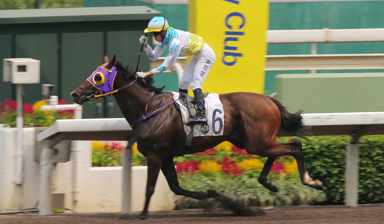 Jerry Chau pumps his fist as he salutes aboard Sure Win Win.
