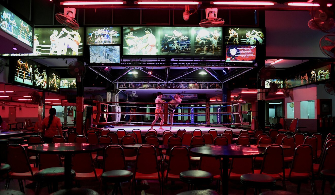 Muay Thai fighters perform inside an empty bar in Pattaya’s Walking Street in March last year. Photo: Reuters