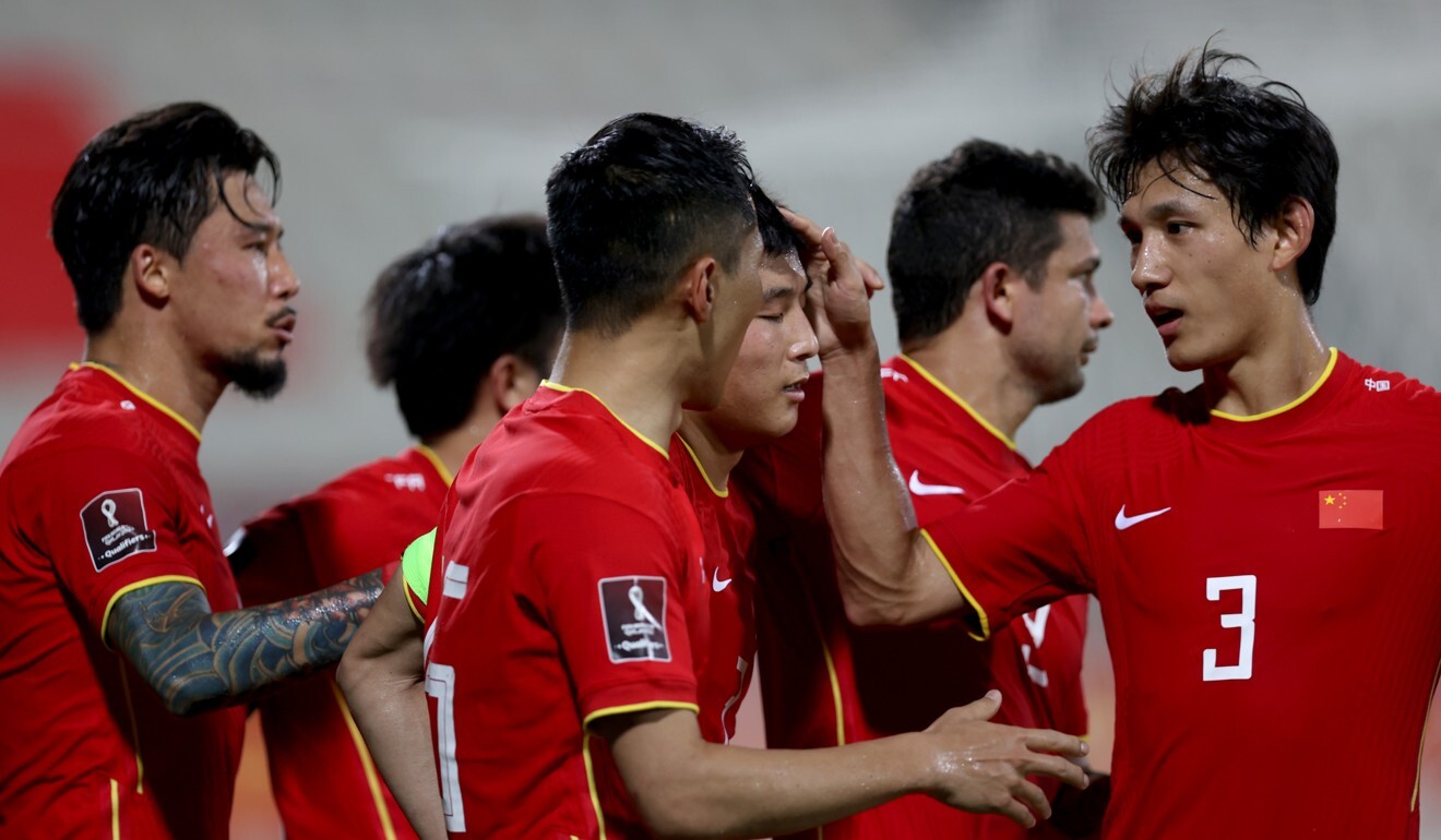 Wu Lei celebrates with teammates after scoring the opening goal in their group A match against the Philippines. Photo: Xinhua