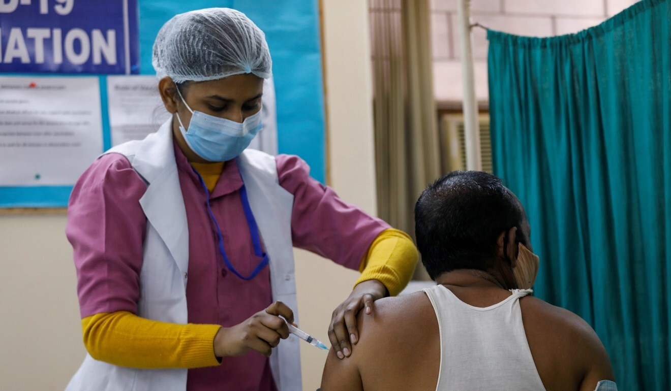 An Indian man receives a vaccine manufactured by Bharat Biotech in New Delhi. Photo: Reuters