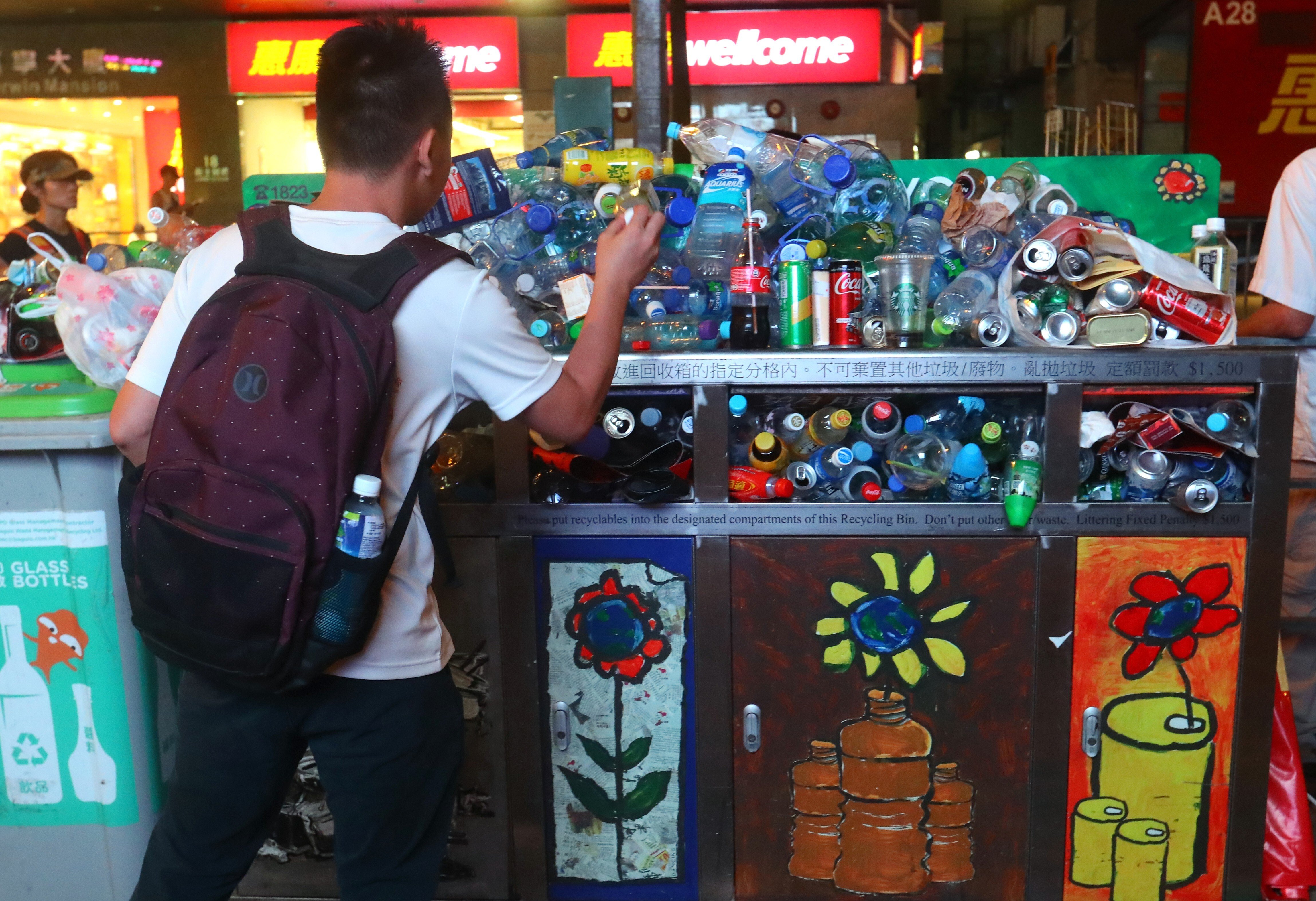 Overfilled recycling bins in Wan Chai on June 9, 2019. The government has good initiatives but more transparency on the goals and outcomes is critical in engaging the public and businesses. Photo: Edmond So