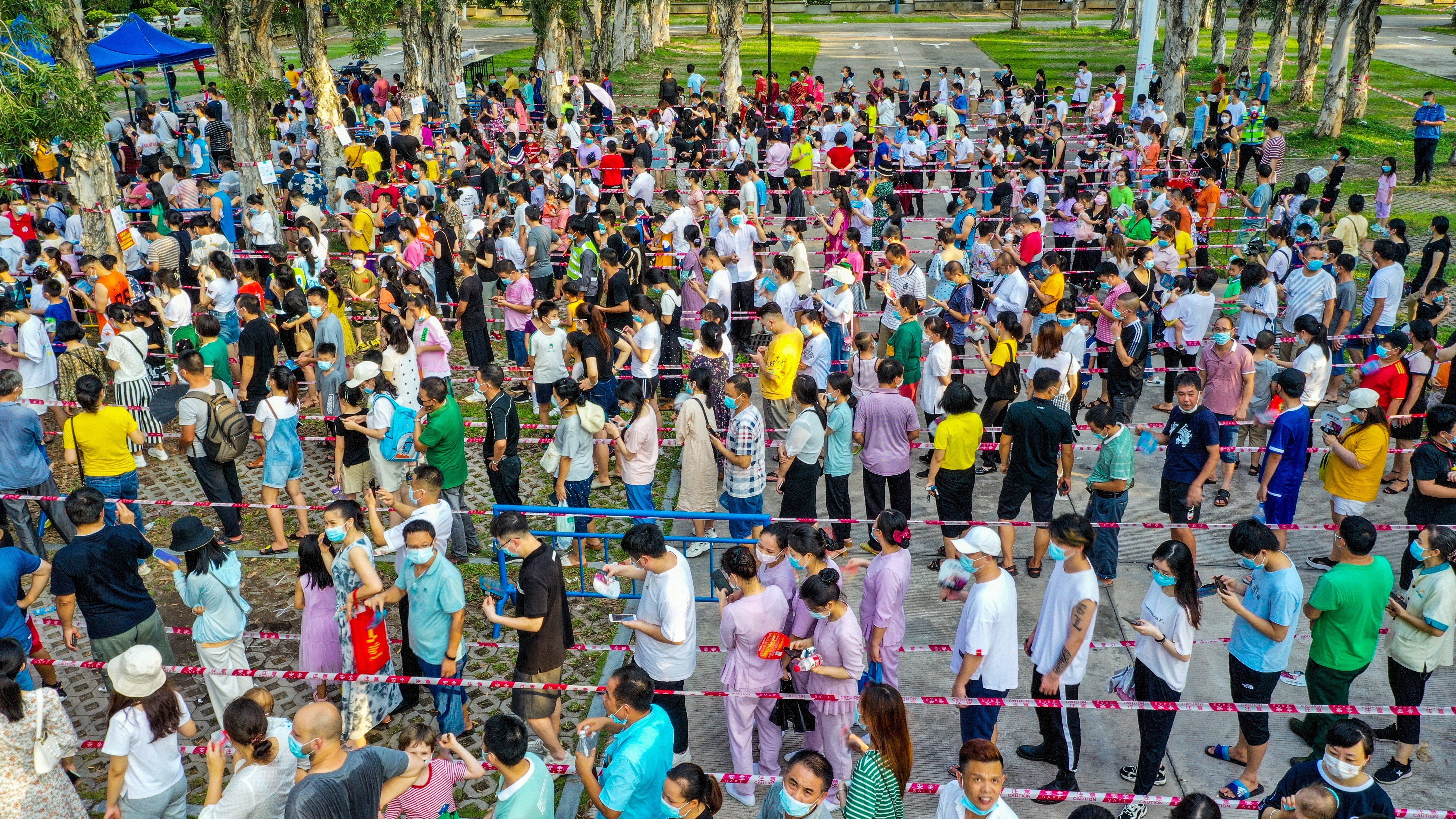 Residents line up to get tested in the township of Changan in Dongguan on Saturday. Photo: VCG