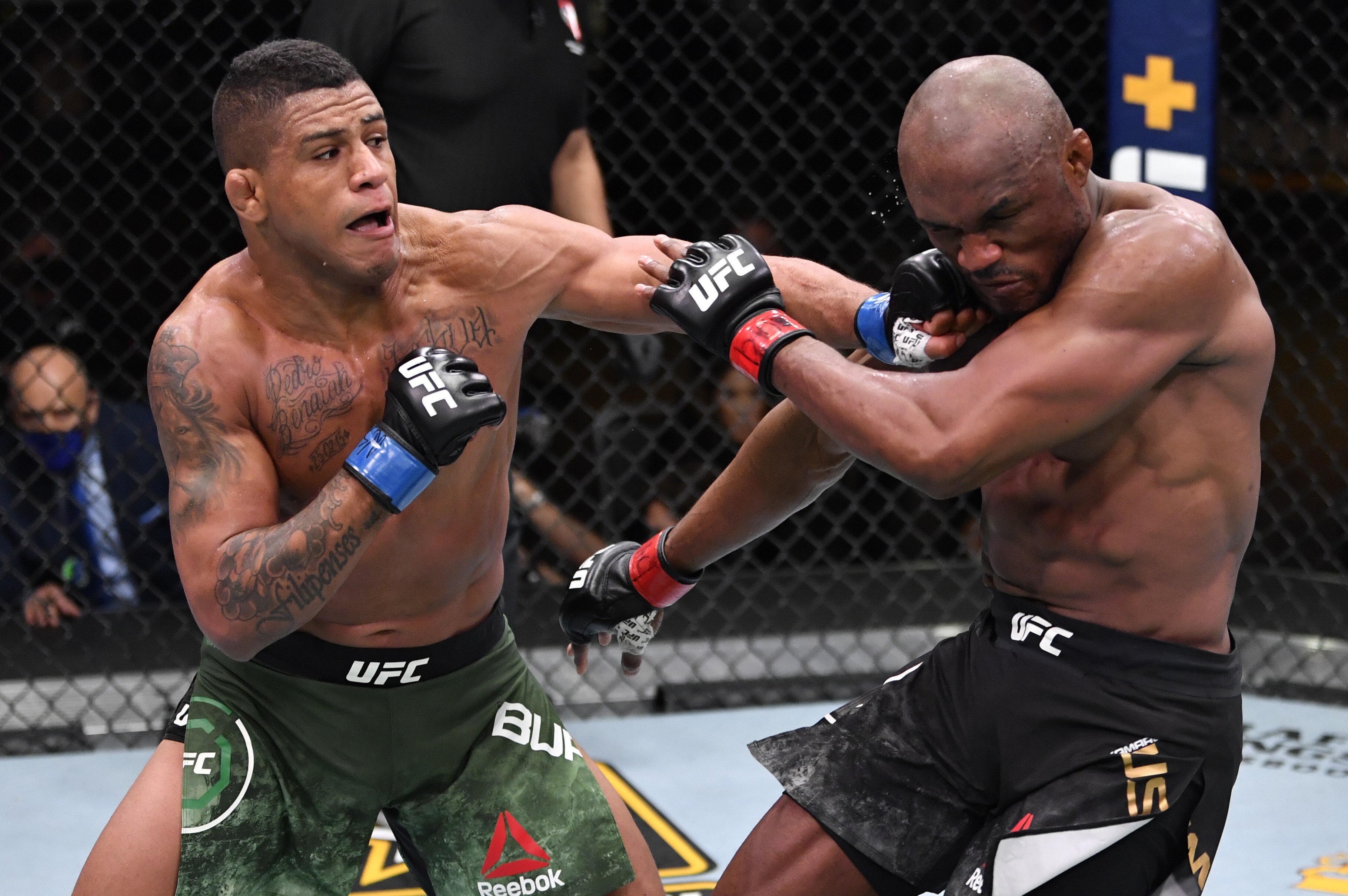 Gilbert Burns punches Kamaru Usman in their welterweight championship fight at UFC 258. Photo: Jeff Bottari/Zuffa LLC