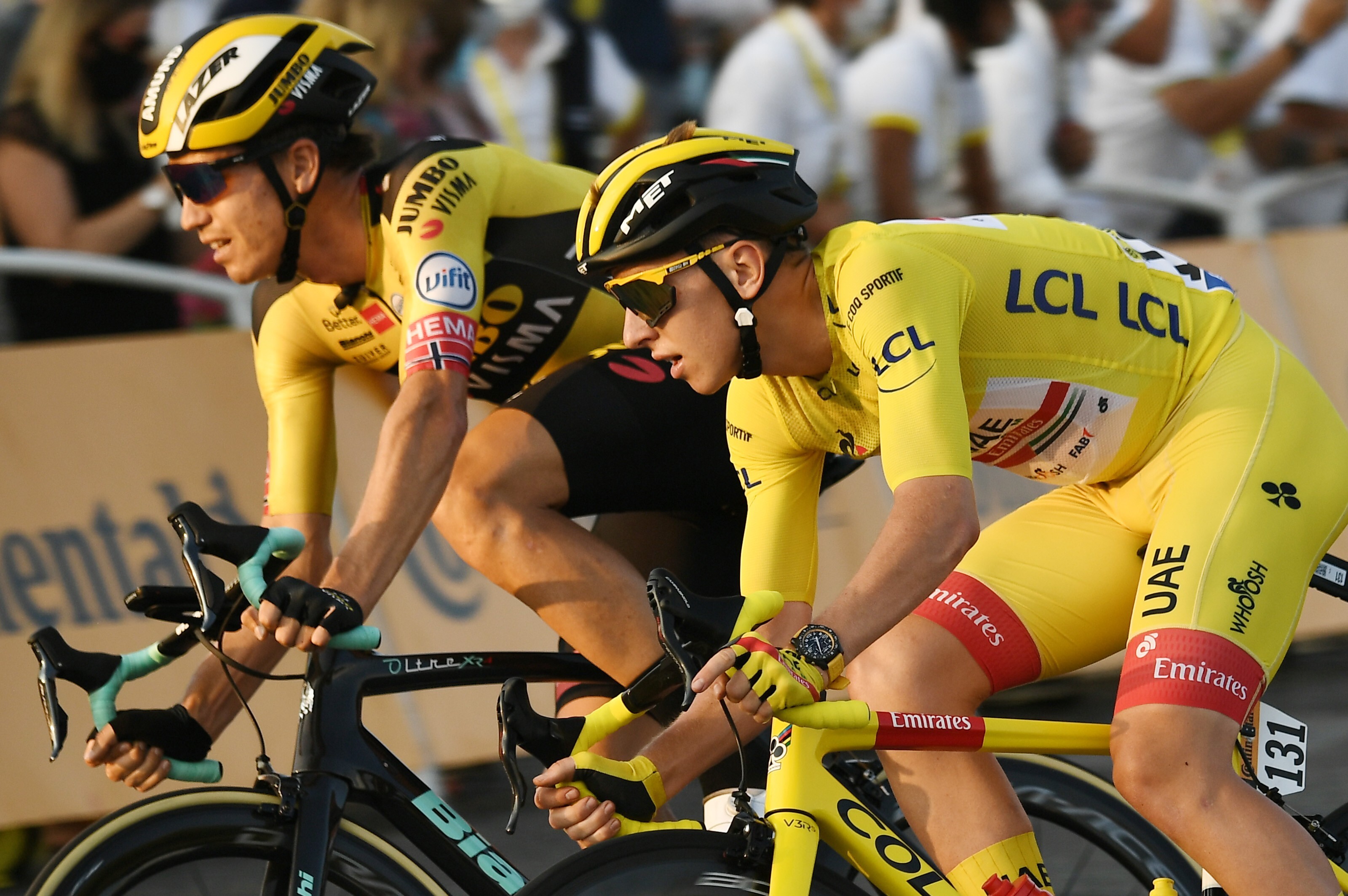 Team UAE Emirates rider Tadej Pogacar (of Slovenia), wearing the overall leader’s yellow jersey, rides next to Team Jumbo rider Wout van Aert (of Belgium) in 2020. The Tour de France is a complicated race with tactics at play and different jerseys up for grabs. Photo: Marco Bertorello/AFP