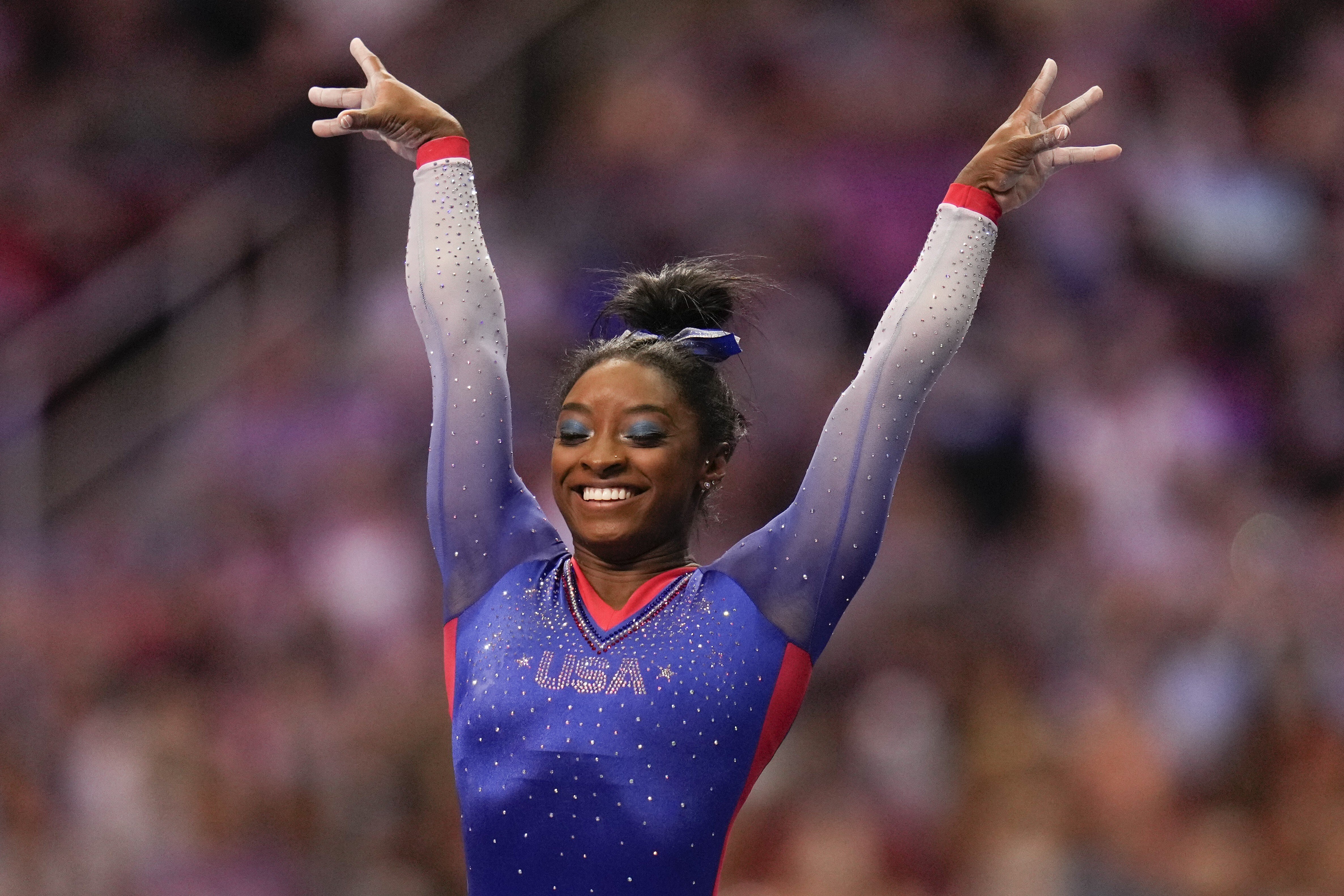 Simone Biles celebrates her performance on the vault during the women's US Olympic Gymnastics Trials. Photo: AP