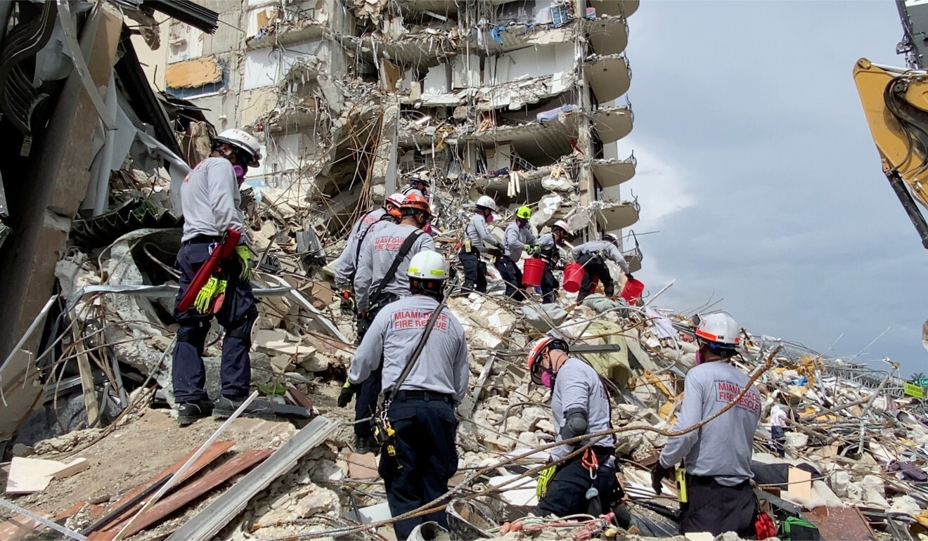 Rescuers search for survivors through the rubble at the Champlain Towers. Photo: Reuters