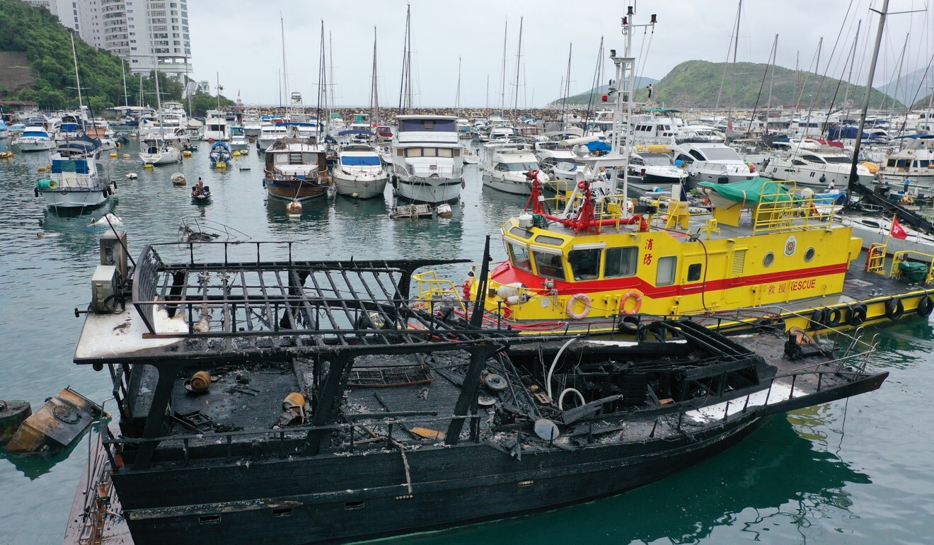 A boat badly damaged in the blaze was still floating early on Sunday morning. Photo: Nora Tam