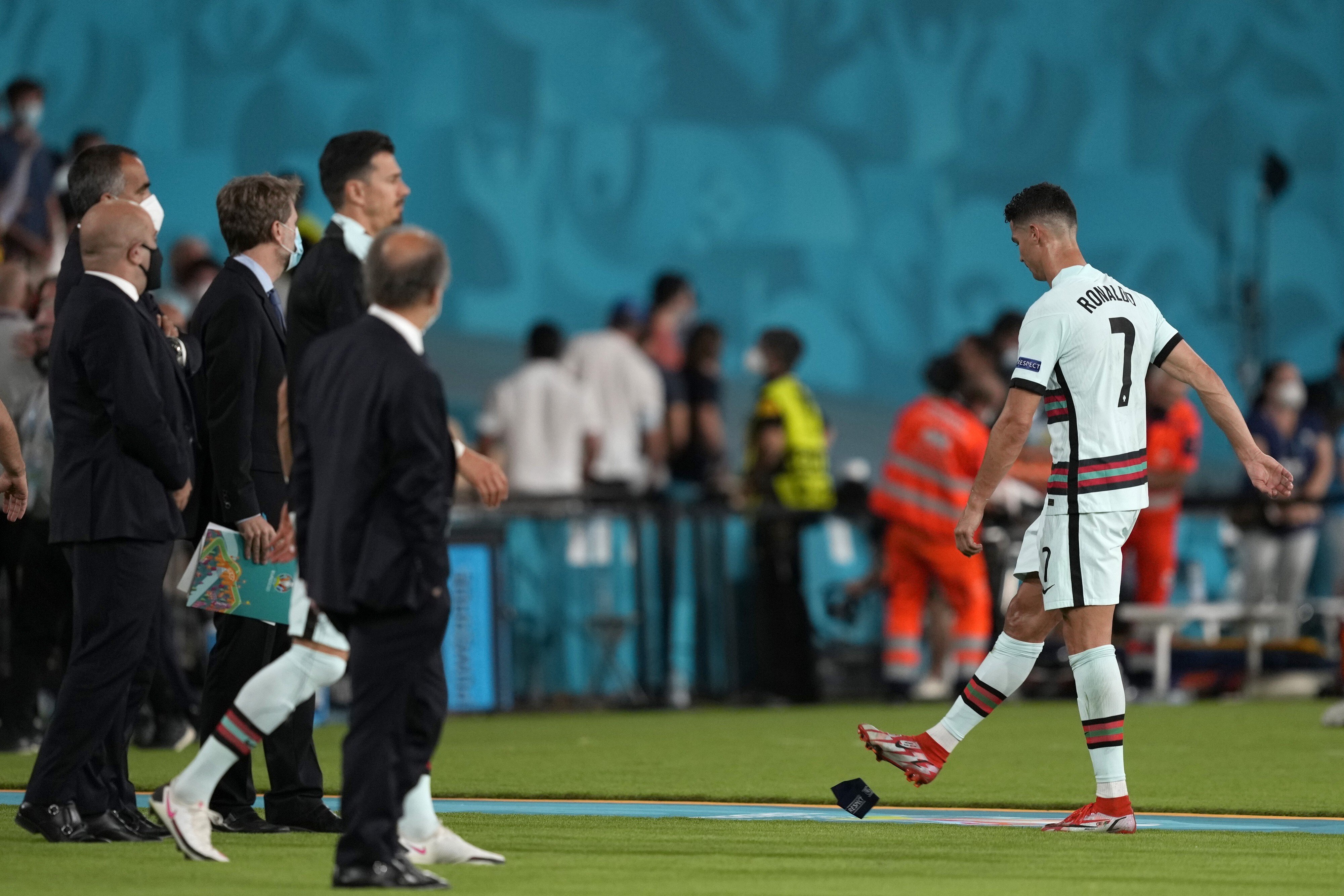 Portugal captain Cristiano Ronaldo kicks away the skipper’s armband after his team is eliminated from Euro 2020. Photo: EPA