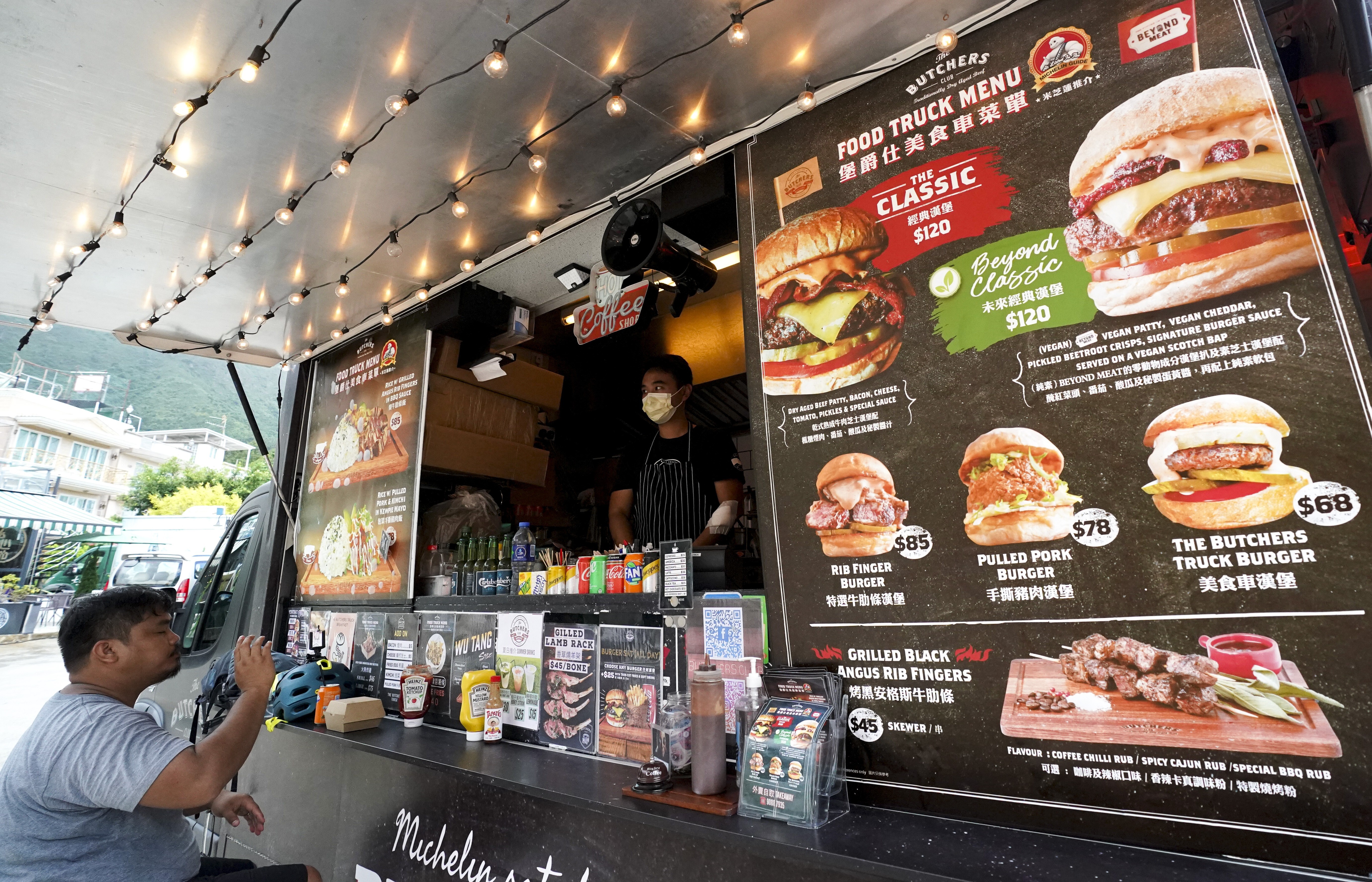 A diner at a food truck in Tai Mei Tuk, Tai Po. Photo: Felix Wong