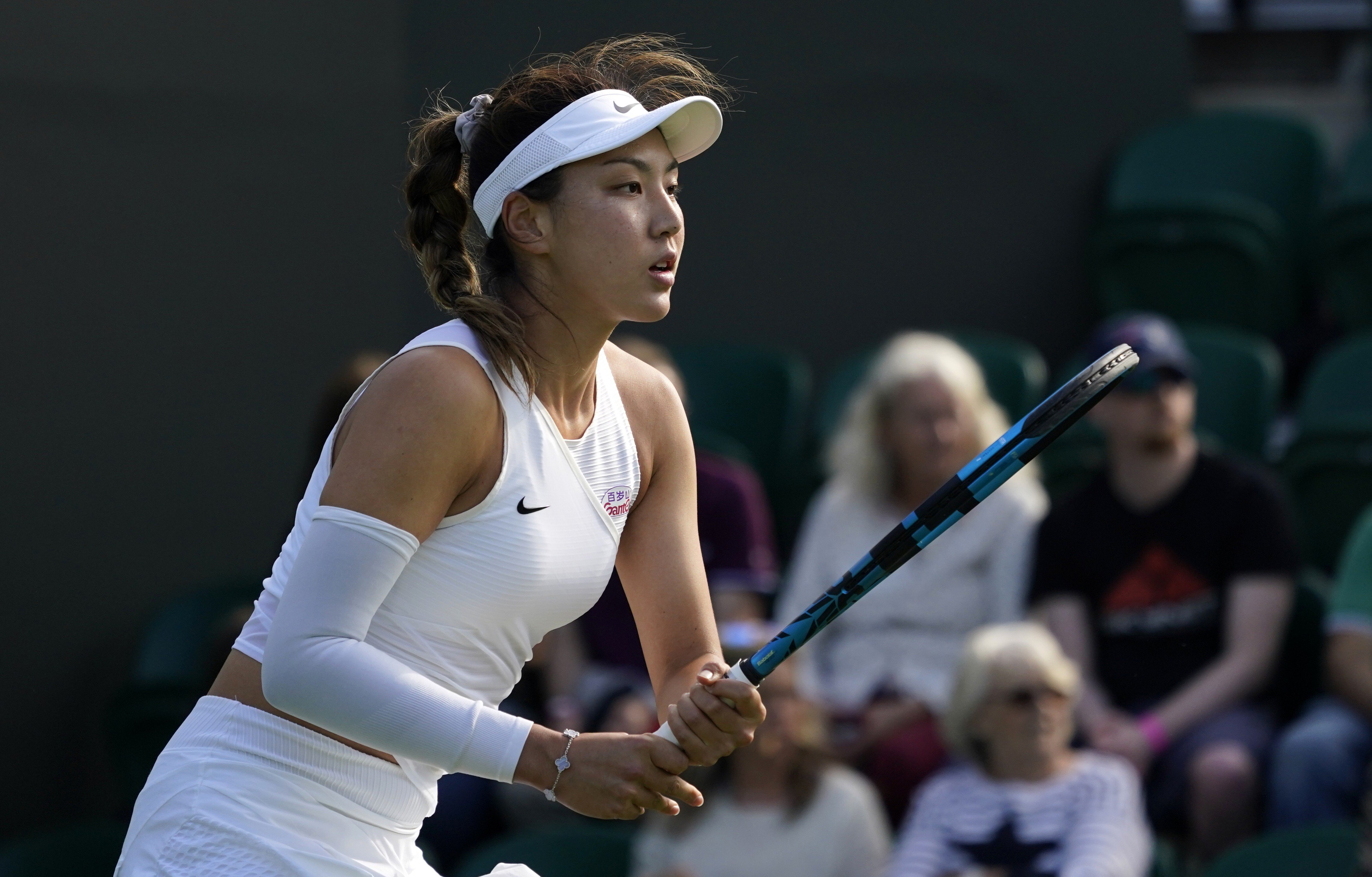 China’s Wang Xinyu waits for Sofia Kenin (US) to serve on day one of Wimbledon in London. Photo: AP