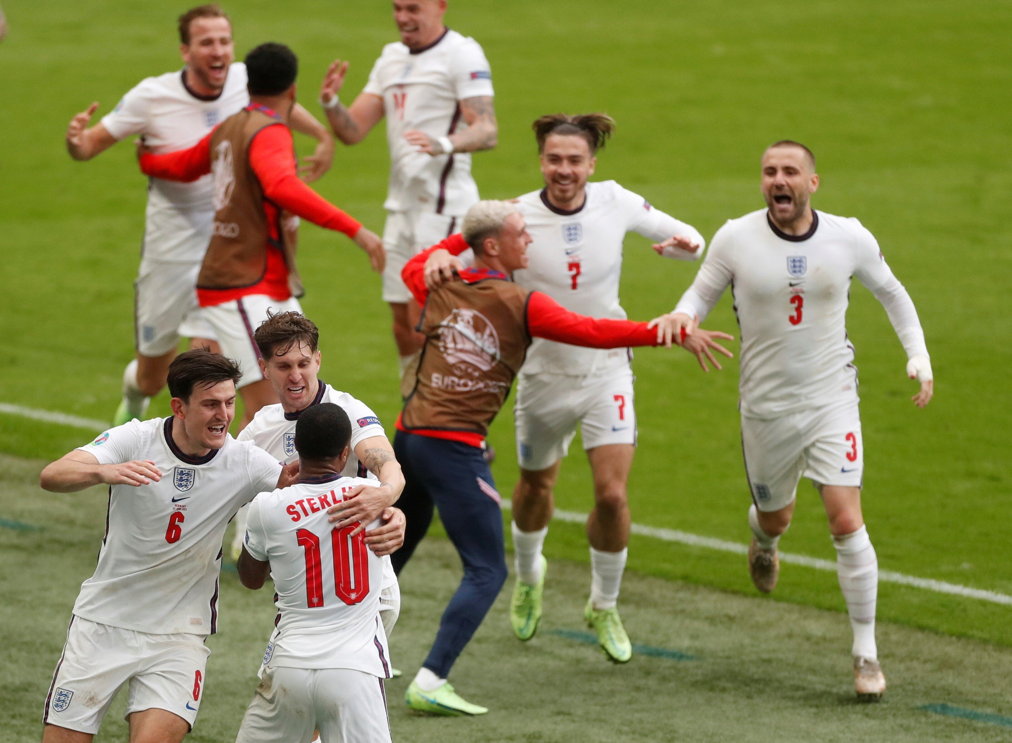 England’s Raheem Sterling celebrates scoring the first goal against Germany with teammates at Wembley Stadium in London on Tuesday. Photo: Reuters