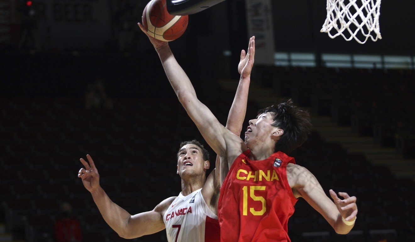 Canada's Dwight Powell battles with China's Zhou Qi. Photo: AP