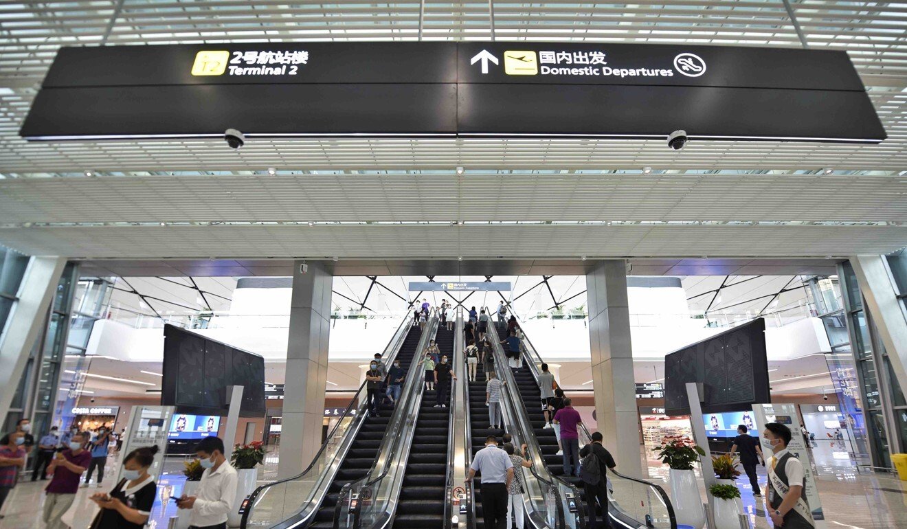 The airport’s two terminals welcomed their first passengers on Sunday. Photo: Xinhua