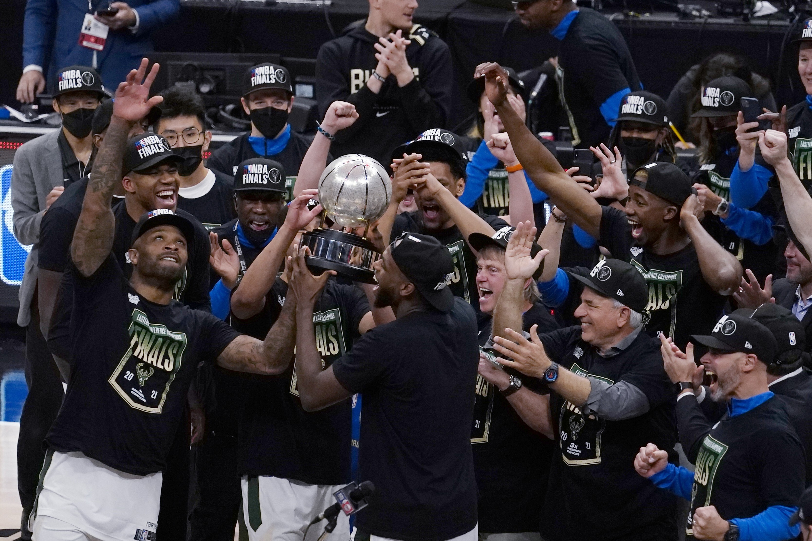 The Milwaukee Bucks celebrate with the Eastern Conference trophy after defeating the Atlanta Hawks in game six. Photo: AP