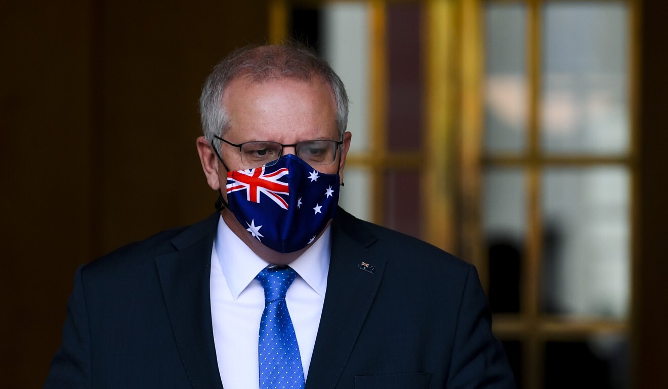 Australian Prime Minister Scott Morrison has announced a four-phase vaccination road map to lay out the steps for the country returning “completely back to normal”. Photo: AAP