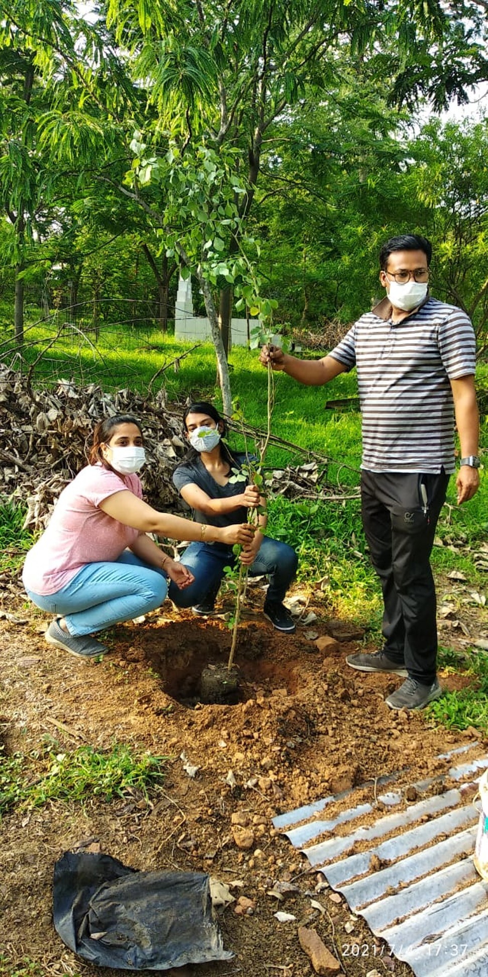 Volunteers plant a sapling at the memorial park near the Bhadbhada Vishram Ghat crematorium. Photo: Handout