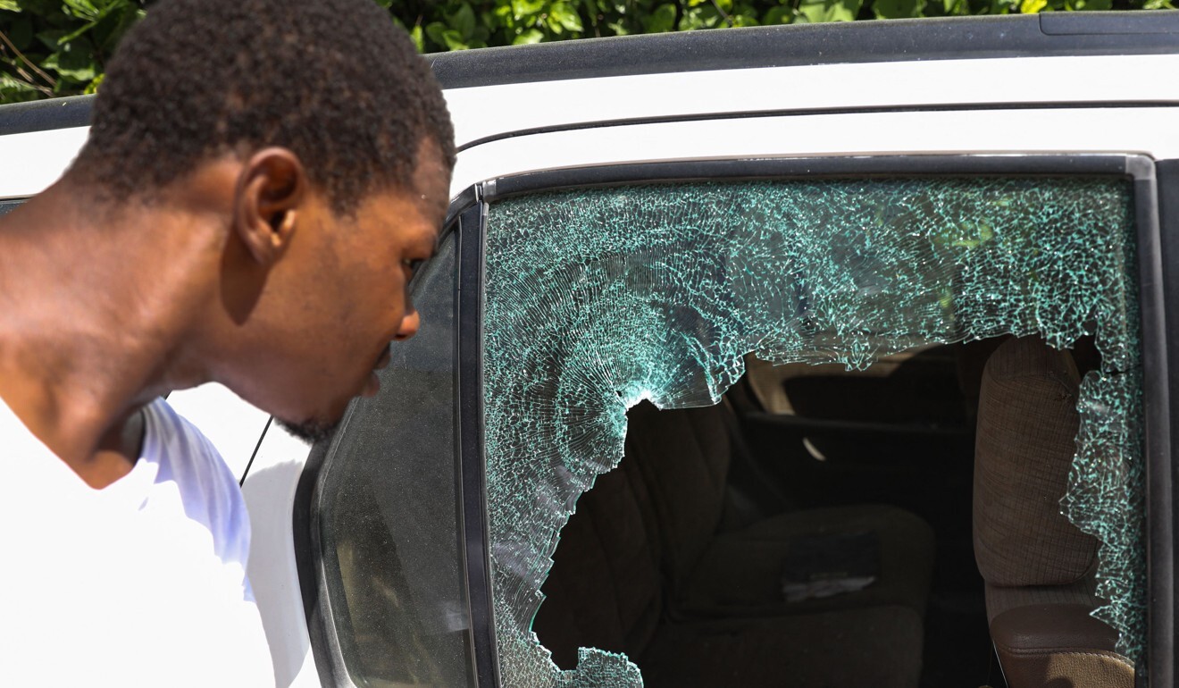 Bullet holes in a car outside the presidential residence in Haiti. Photo: AFP