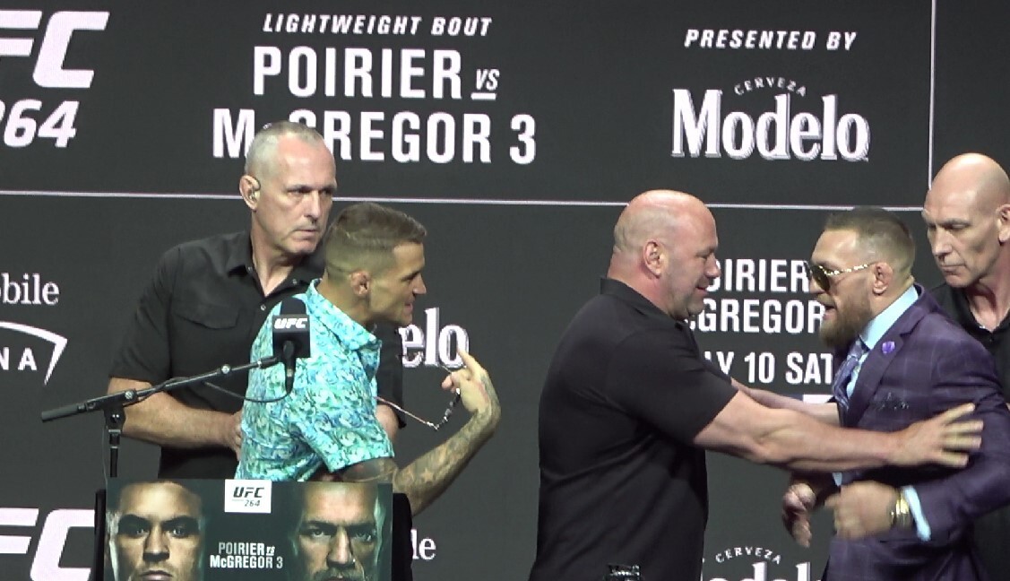 Dustin Poirier scuffles with Conor McGregor (left) ahead of their UFC 264 trilogy fight. Photo: Drake Riggs