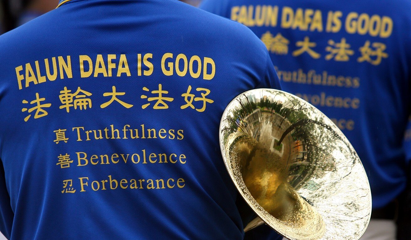 In April 2009, Falun Gong marched from Victoria Park to Beijing’s liaison office in the city to protest alleged persecution at the hands of the Chinese government. Photo: Jonathan Wong