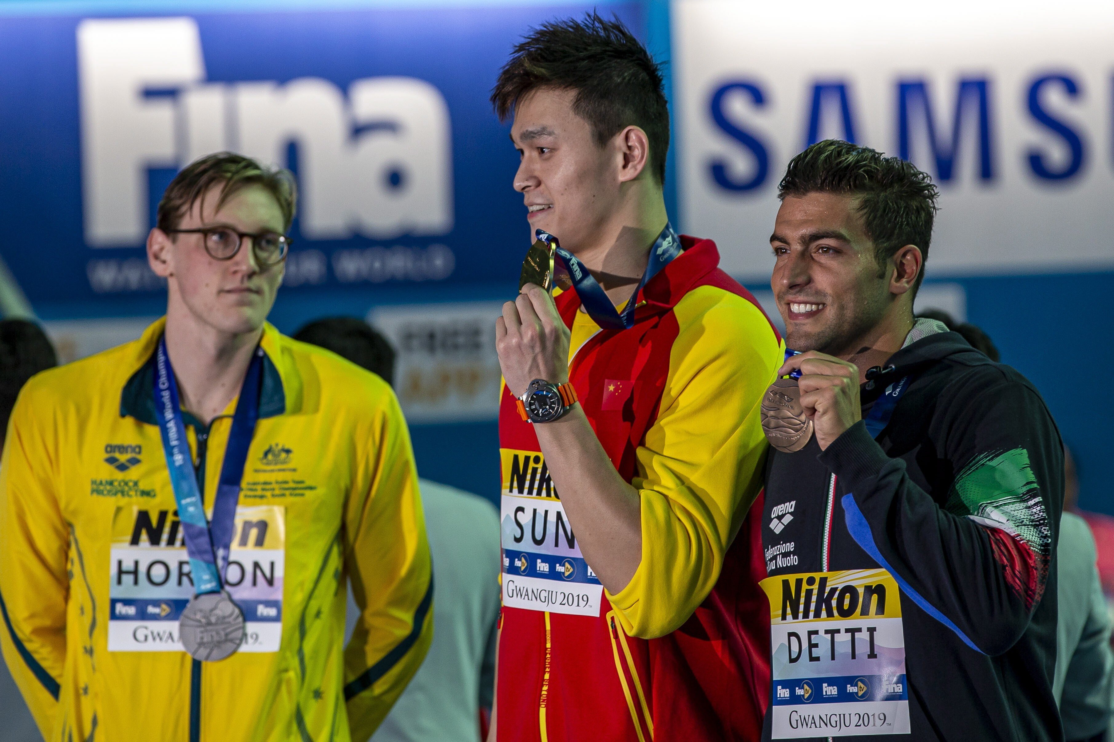 Mack Horton, of Australia, and winner Yang Sun, of China, at the podium medal awards after the men's 400m freestyle final at the Fina World Championships in Gwangju, South Korea in 2019. Photo: EPA