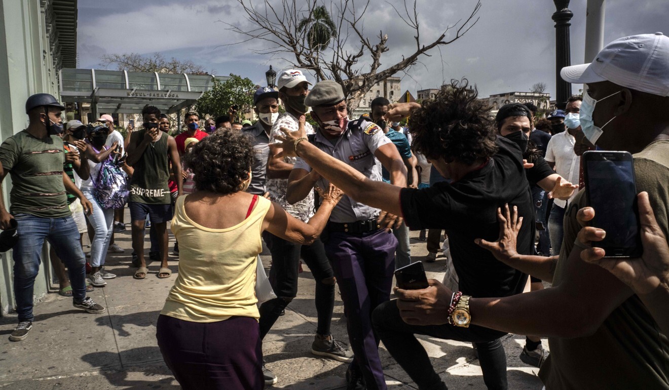 Police scuffle and detain an anti-government demonstrator during a protest in Havana, Cuba. Photo: AP