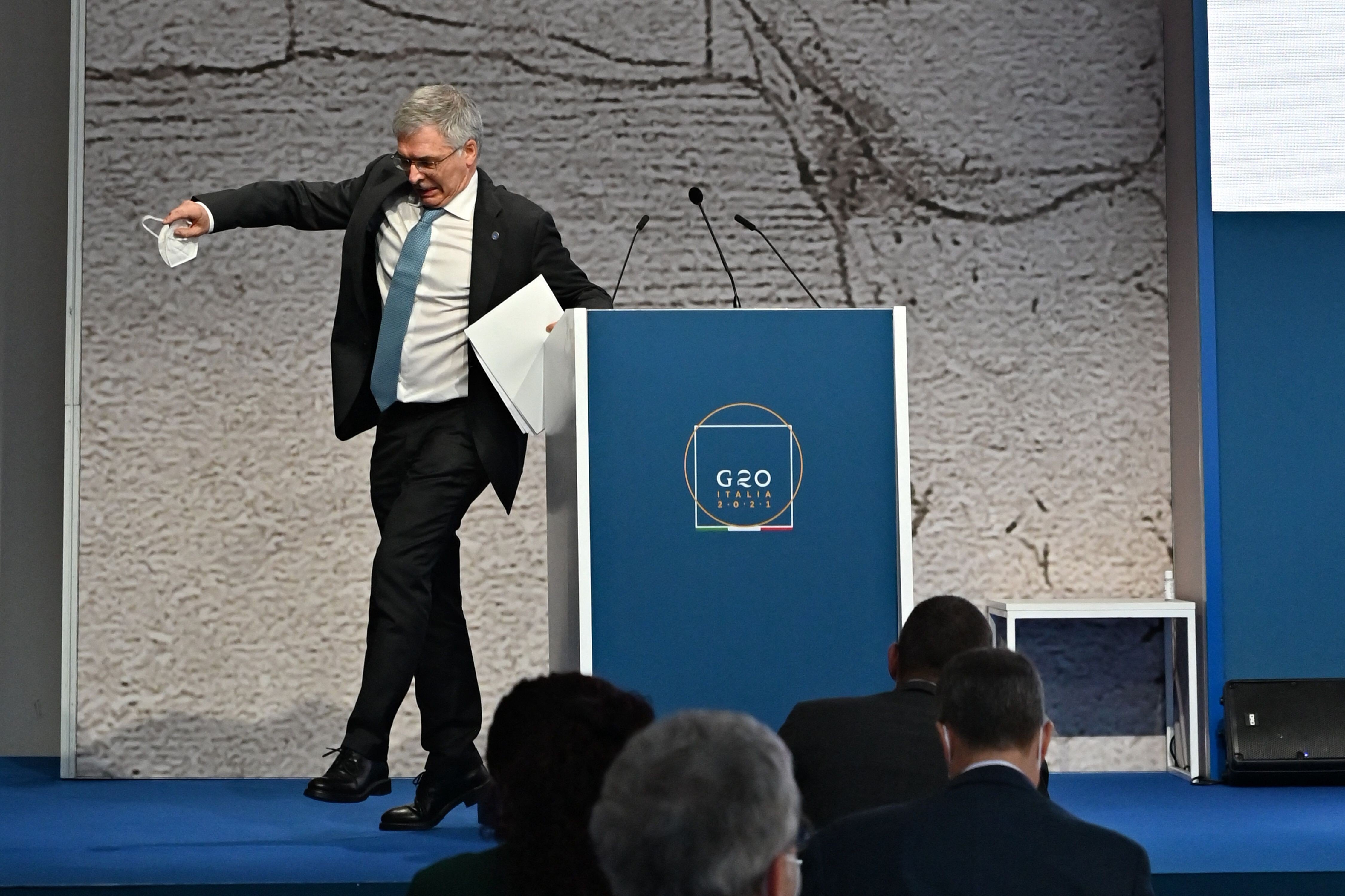 Daniele Franco, Italy's Minister of Economy and Finance, stumbles after his speech during a press conference on Friday at the G20 finance ministers and central bankers meeting in Venice. Global tax reform is at the top of the agenda as the world's biggest economies seek to ensure multinational companies pay their fair share. Photo: AFP