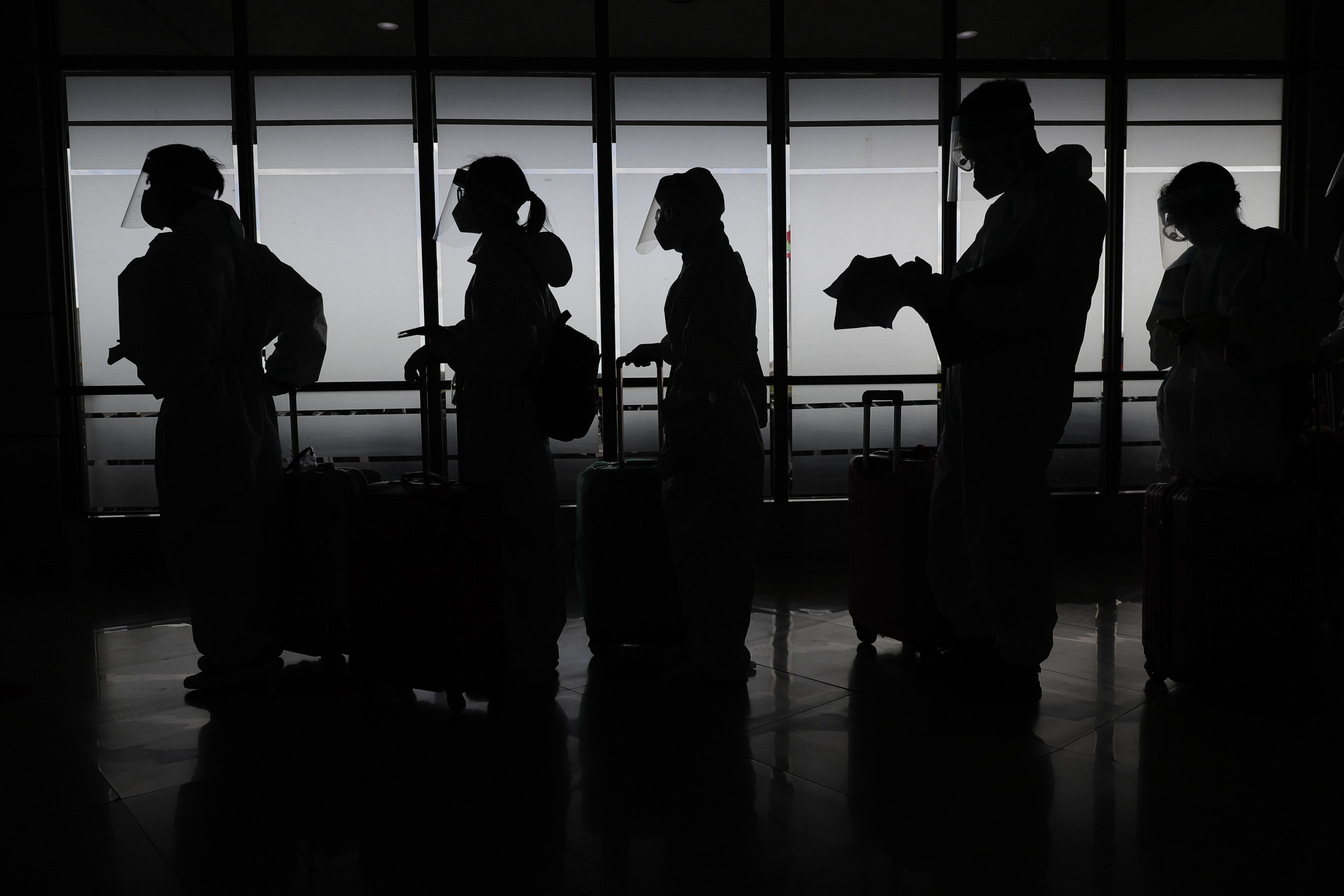 Passengers prepare to travel at Manila's International Airport in the Philippines. Photo: AP