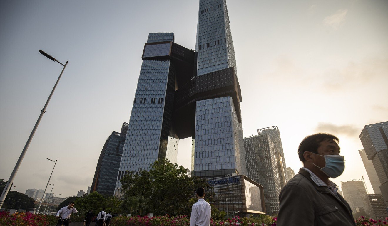 People walk near the Tencent Holdings headquarters in Shenzhen. Guangdong province has tasked the tech hub with building a big data centre for the Greater Bay Area, which includes Hong Kong and Macau. Photo: Bloomberg