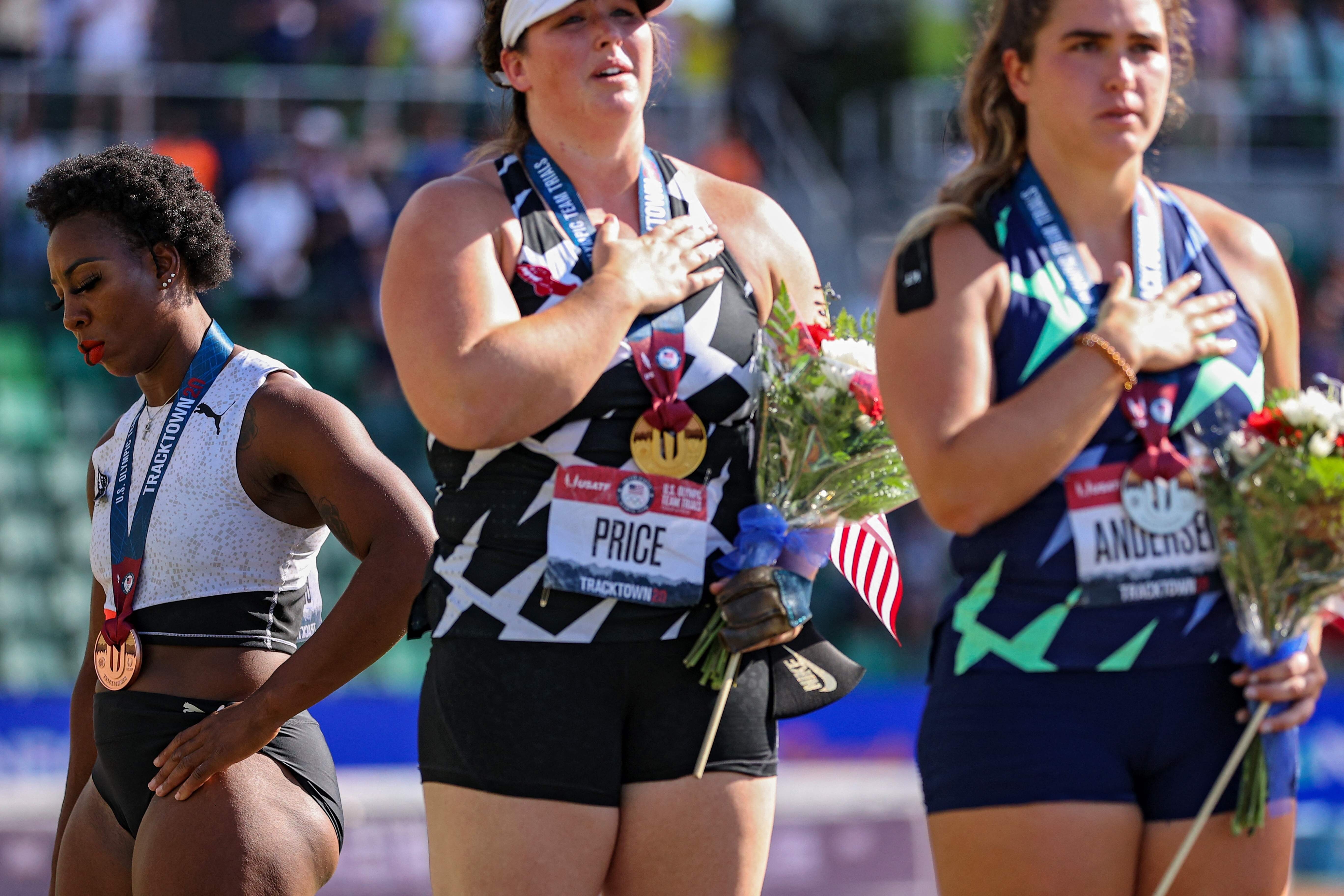US hammer thrower Gwen Berry (left) turned away while the national anthem played at the Olympic trials. Photo: AFP