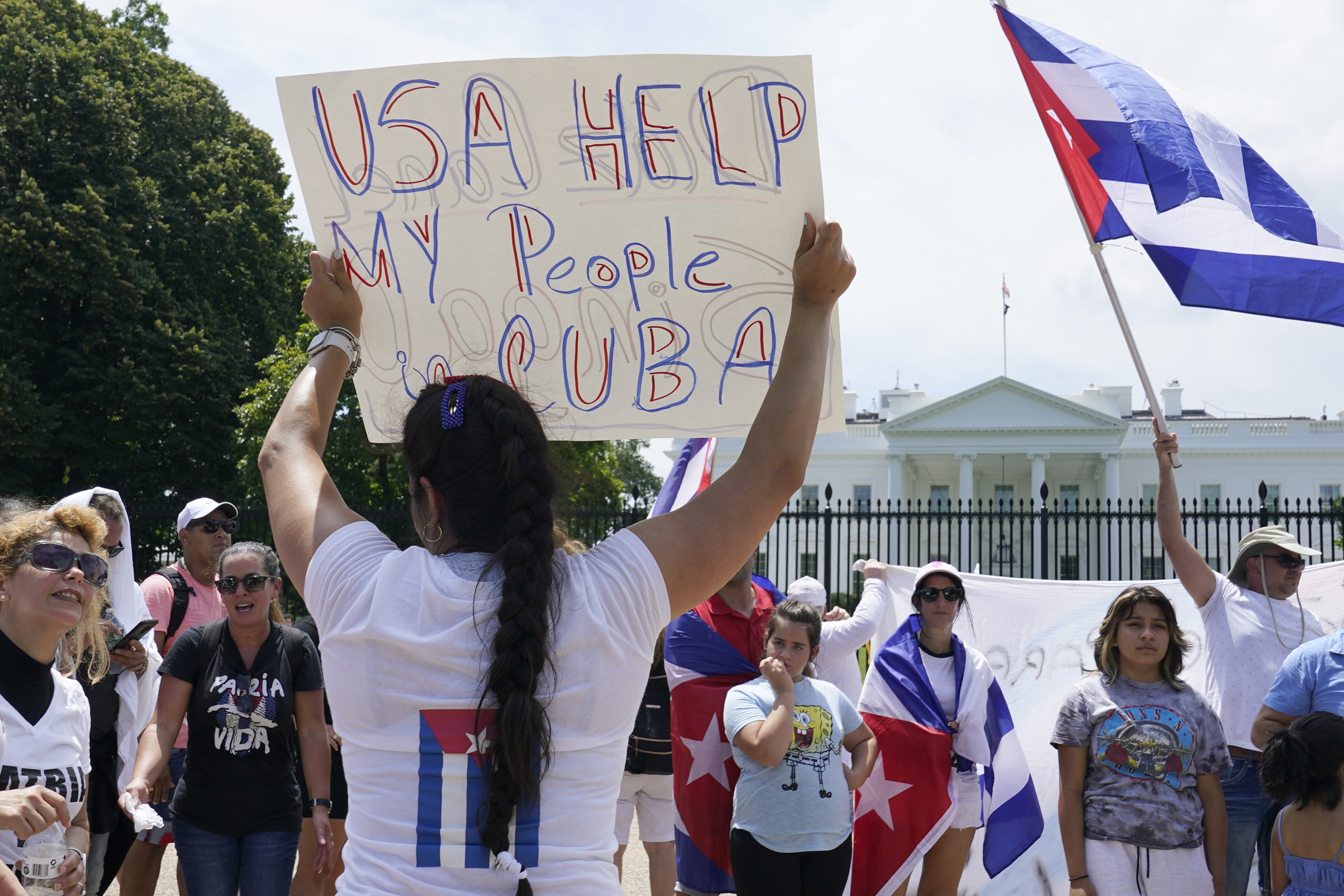 People rally outside the White House in Washington in support of the protesters in Cuba. Photo: AP