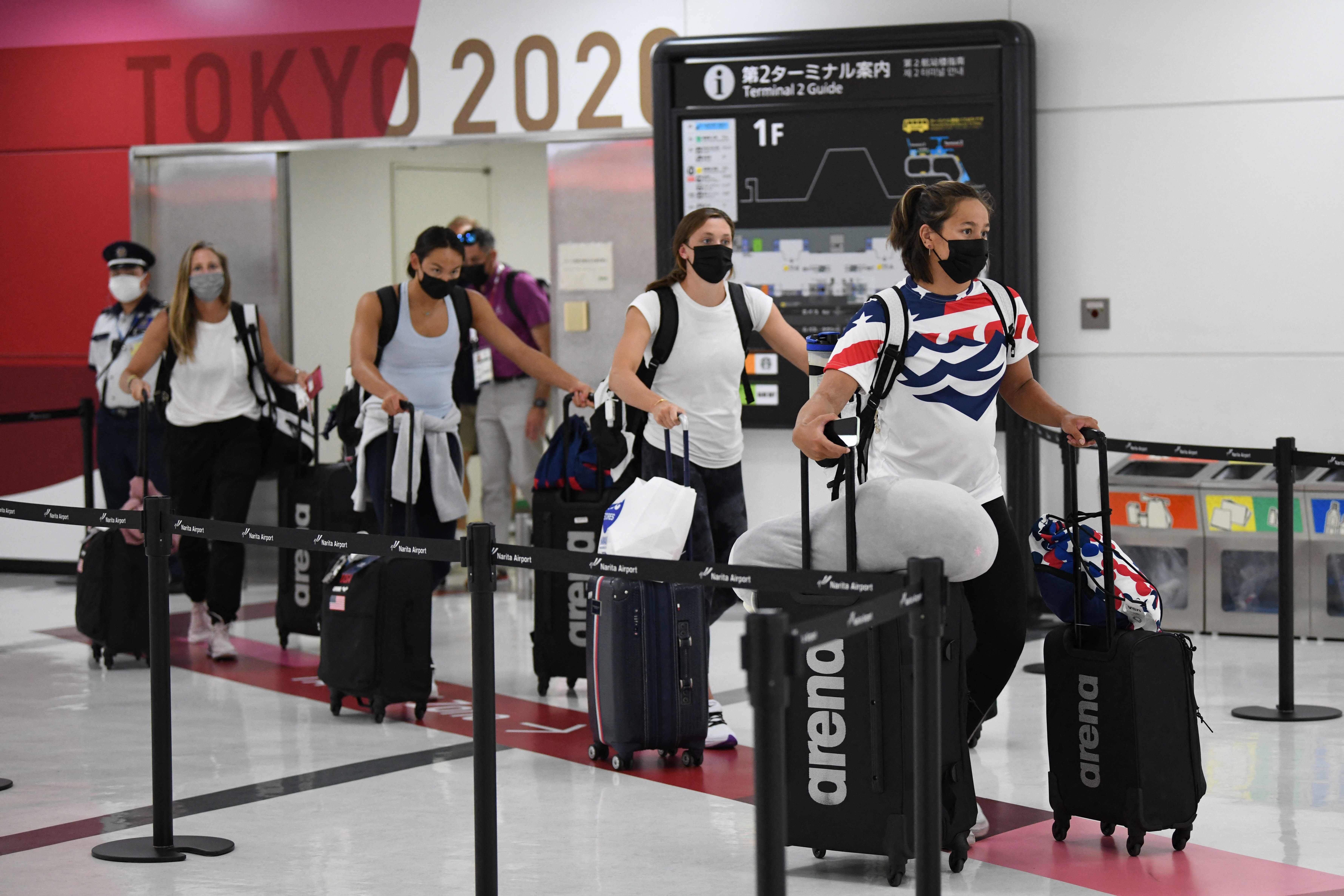 The US Olympic swimming team arrive for the Tokyo 2020 Olympic Games at Narita international airport. Photo: AFP
