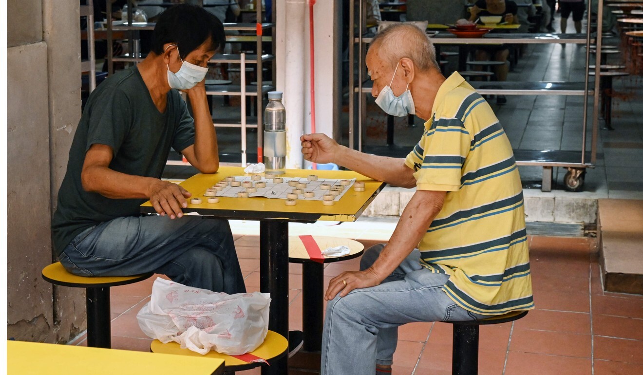 Singapore reimposes coronavirus curbs as karaoke bar cluster upends