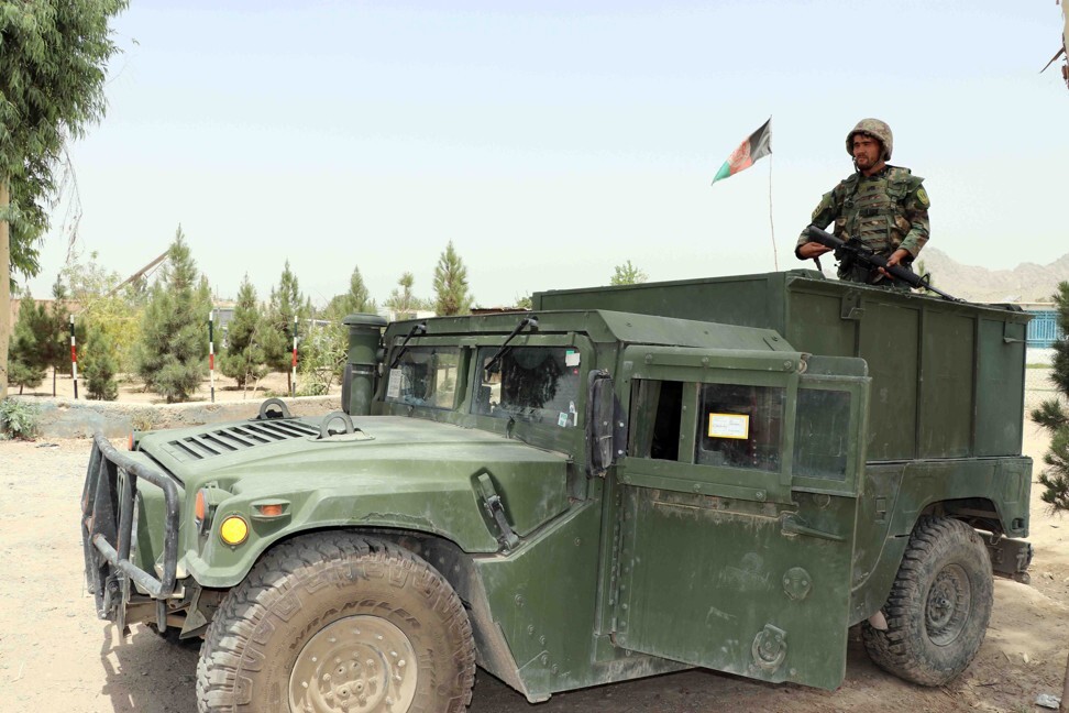 An Afghan security official stands guard at a check point in Kandahar. Photo: EPA-EFE