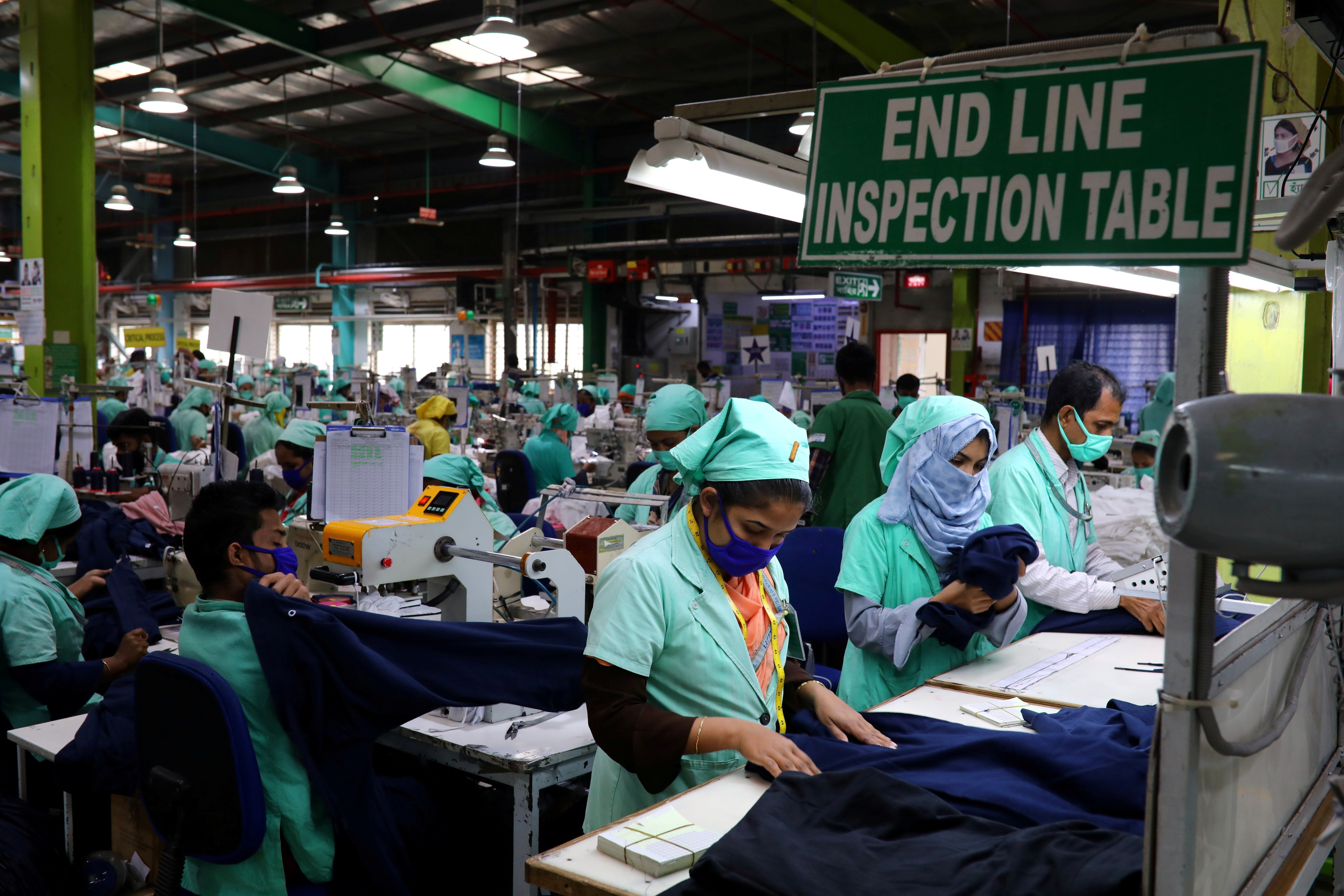 Garment employees work at Fakhruddin Textile Mills Limited in Gazipur, Bangladesh. Smaller-scale suppliers in Bangladesh would be greatly affected by rising water levels. Photo: Reuters