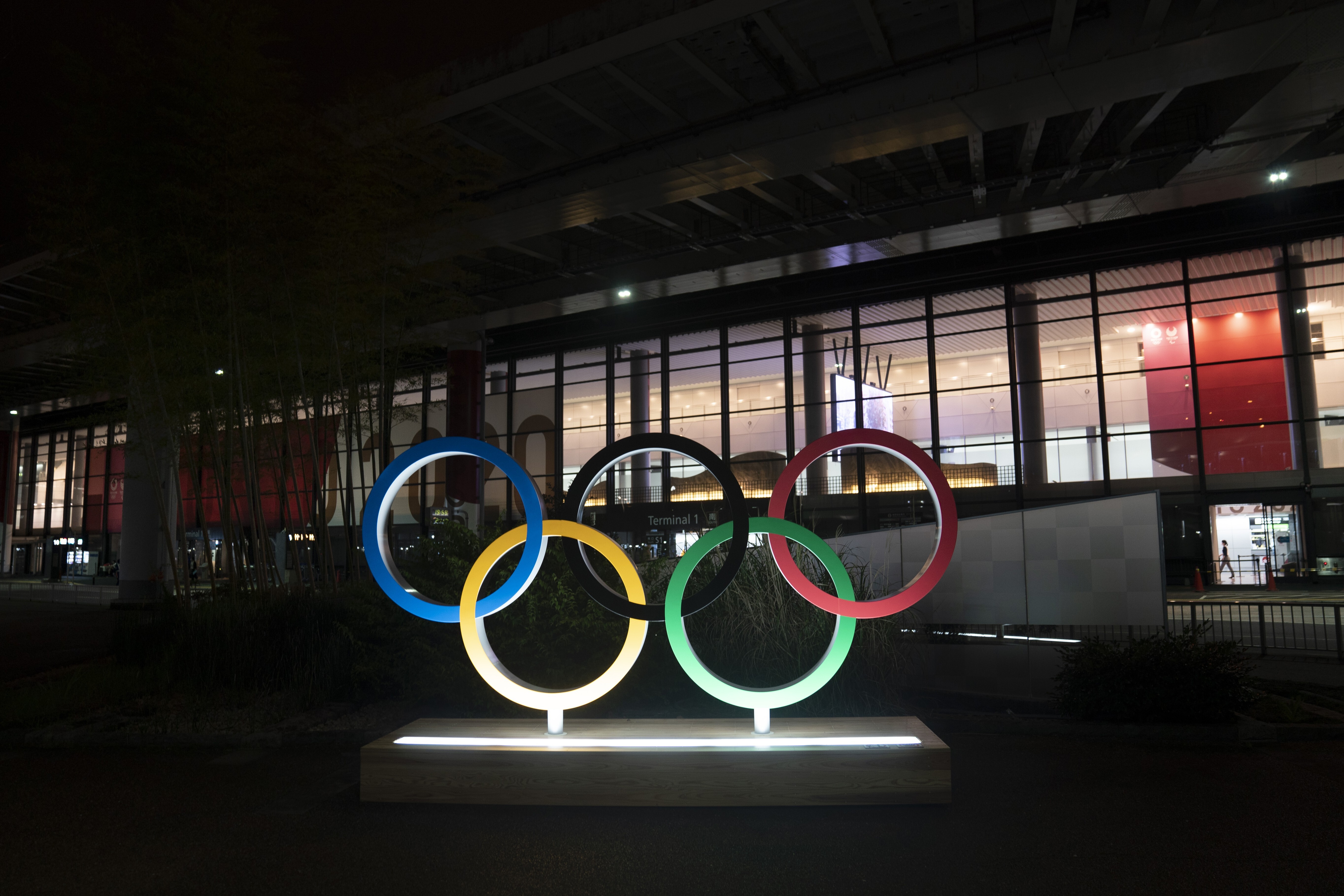 The Olympic rings are seen illuminated outside Narita International Airport near Tokyo. Photo: AP
