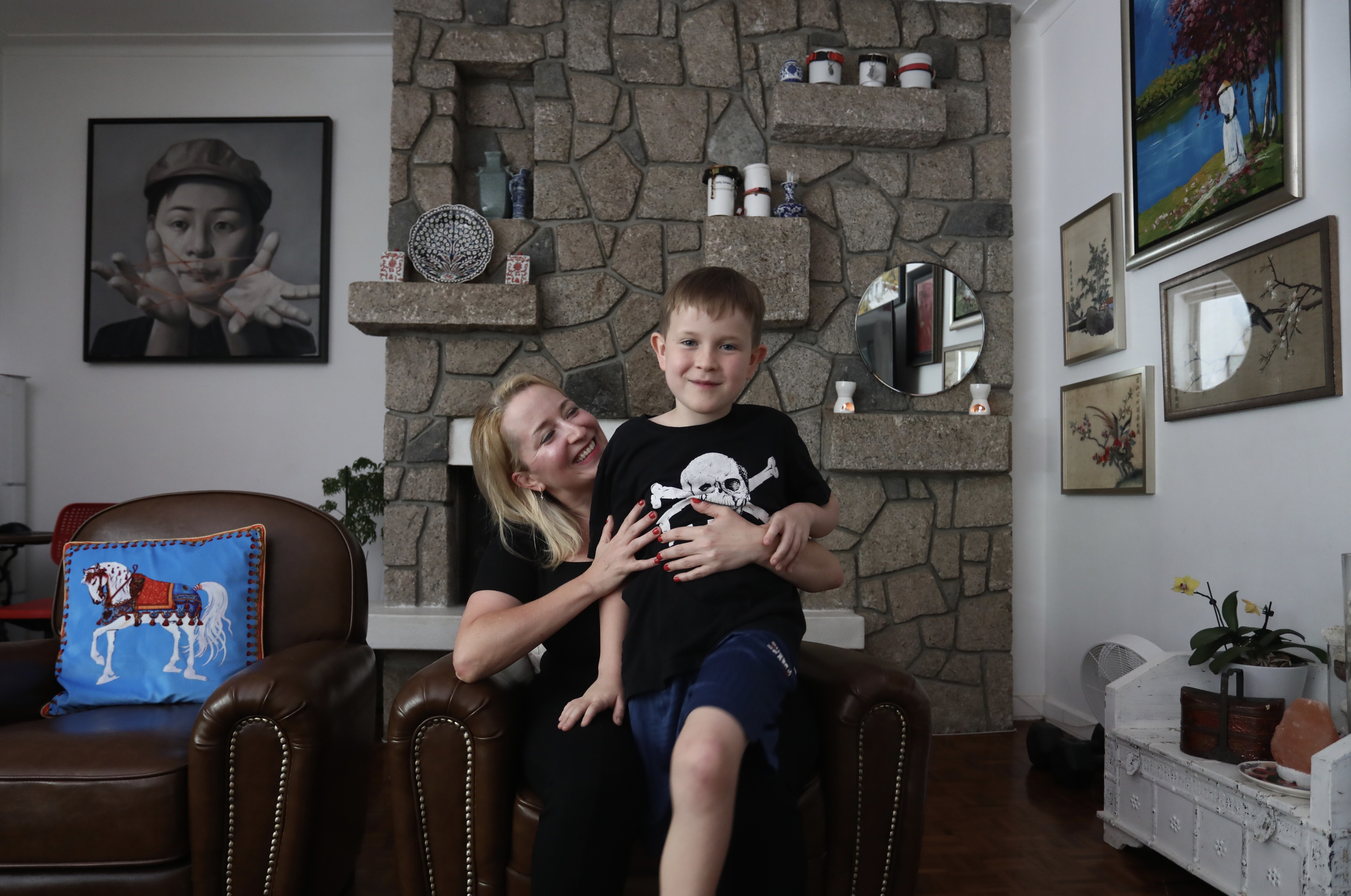 Mary Schaus with her eight-year-old son Alexander at their home in Pok Fu Lam. Photo: Jonathan Wong