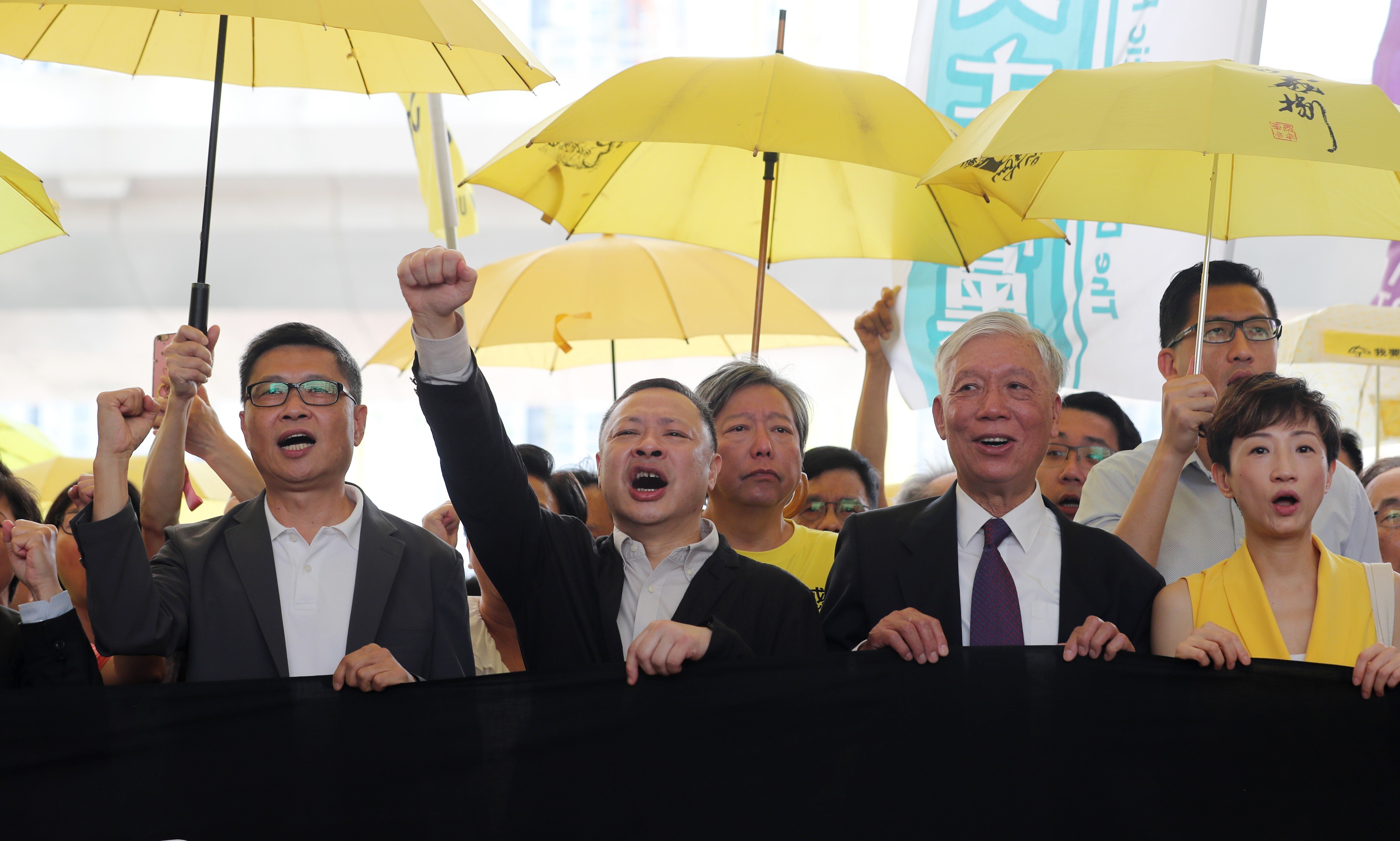 Sociologist Chan Kin-man (left) and fellow Occupy movement founders Benny Tai (centre) and Reverend Chu Yiu-ming (right) appear at West Kowloon Court in 2019. Photo: Sam Tsang