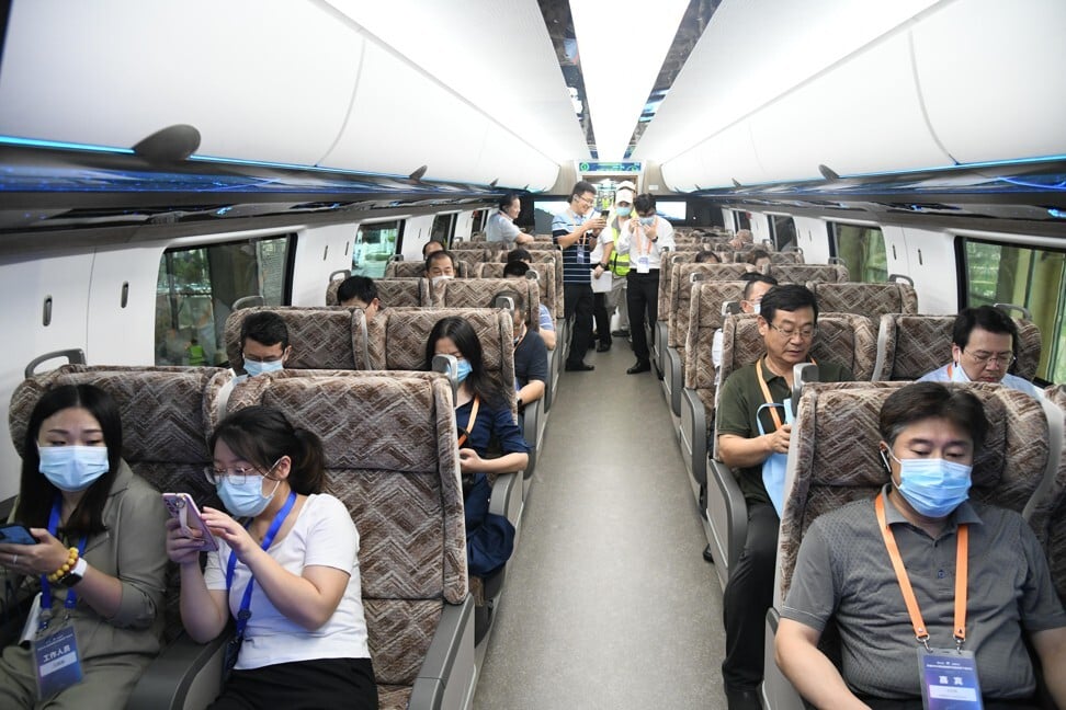 Visitors get a feel for the inside of China’s new high-speed maglev train in Qingdao on Tuesday. Photo: Xinhua