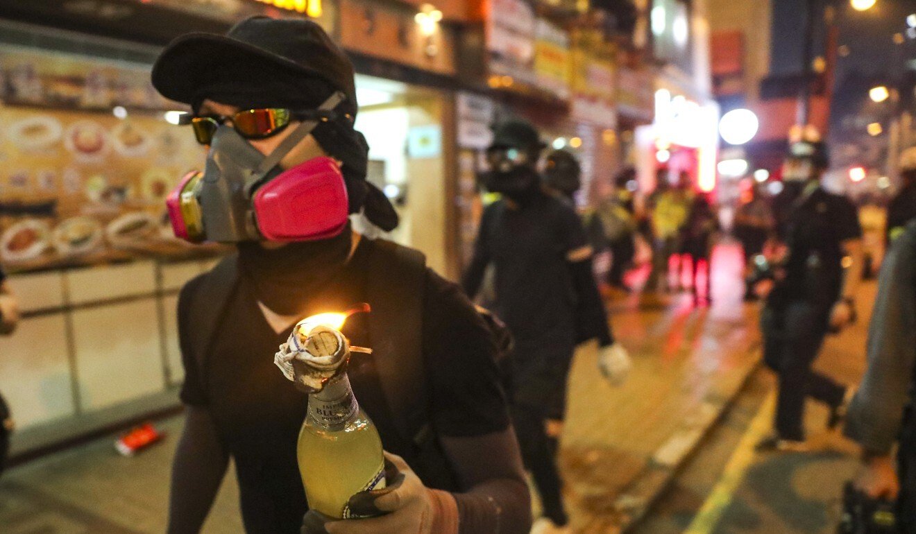Protesters fuse petrol bombs to use as weapons during an anti-extradition bill march from Causeway Bay towards Wan Chai and Admiralty in 2019. Photo: Sam Tsang