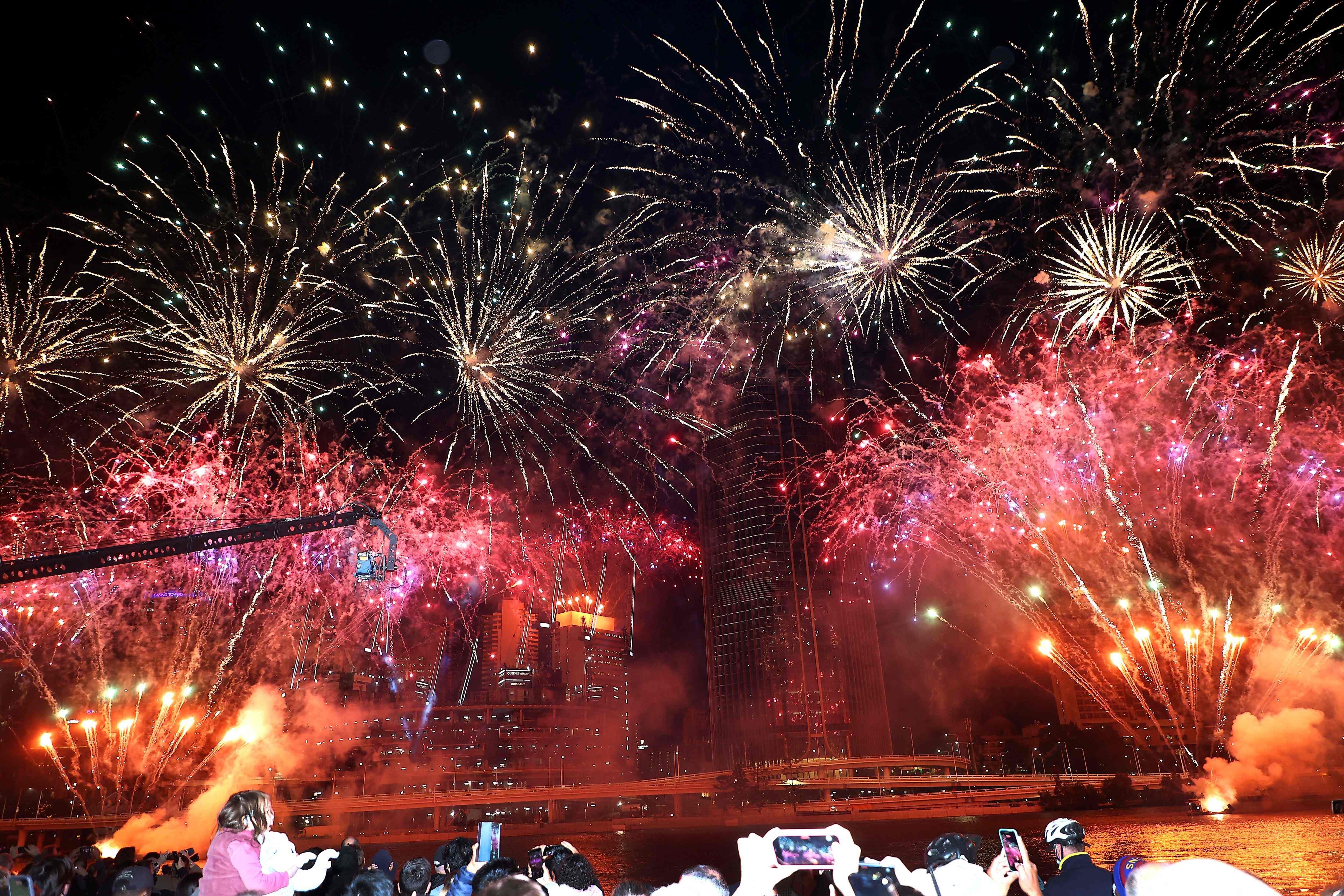 Fireworks fill the sky in Brisbane on Wednesday after the Australian city was named host of the 2032 Olympics by the IOC. Photo: AFP