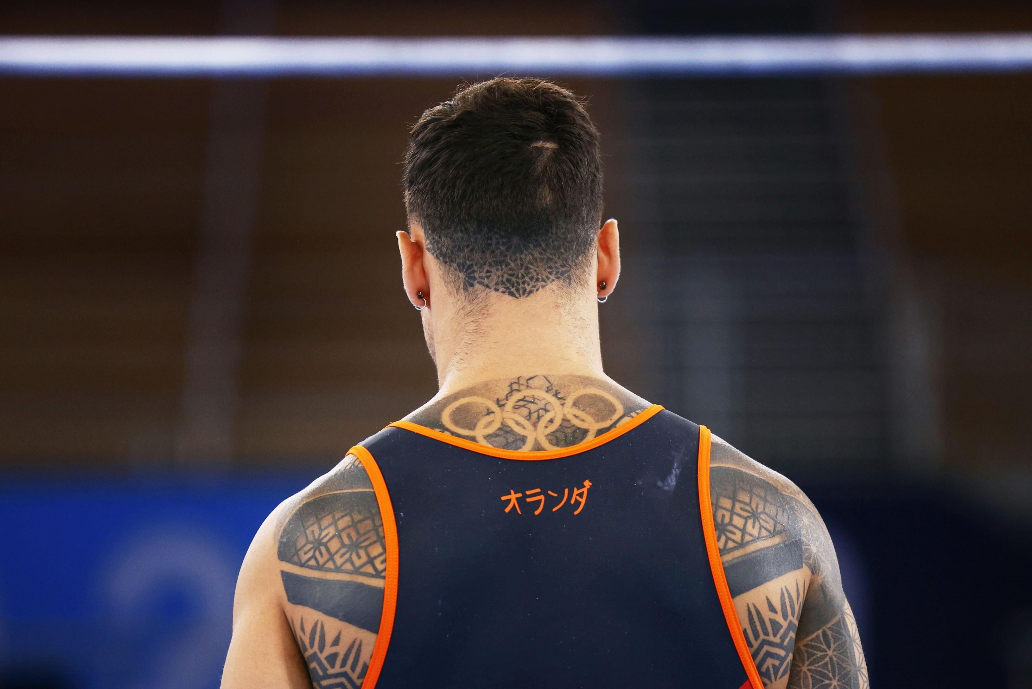 Bart Deurloo of the Netherlands sporting his Olympic rings tattoo. Photo: Kyodo