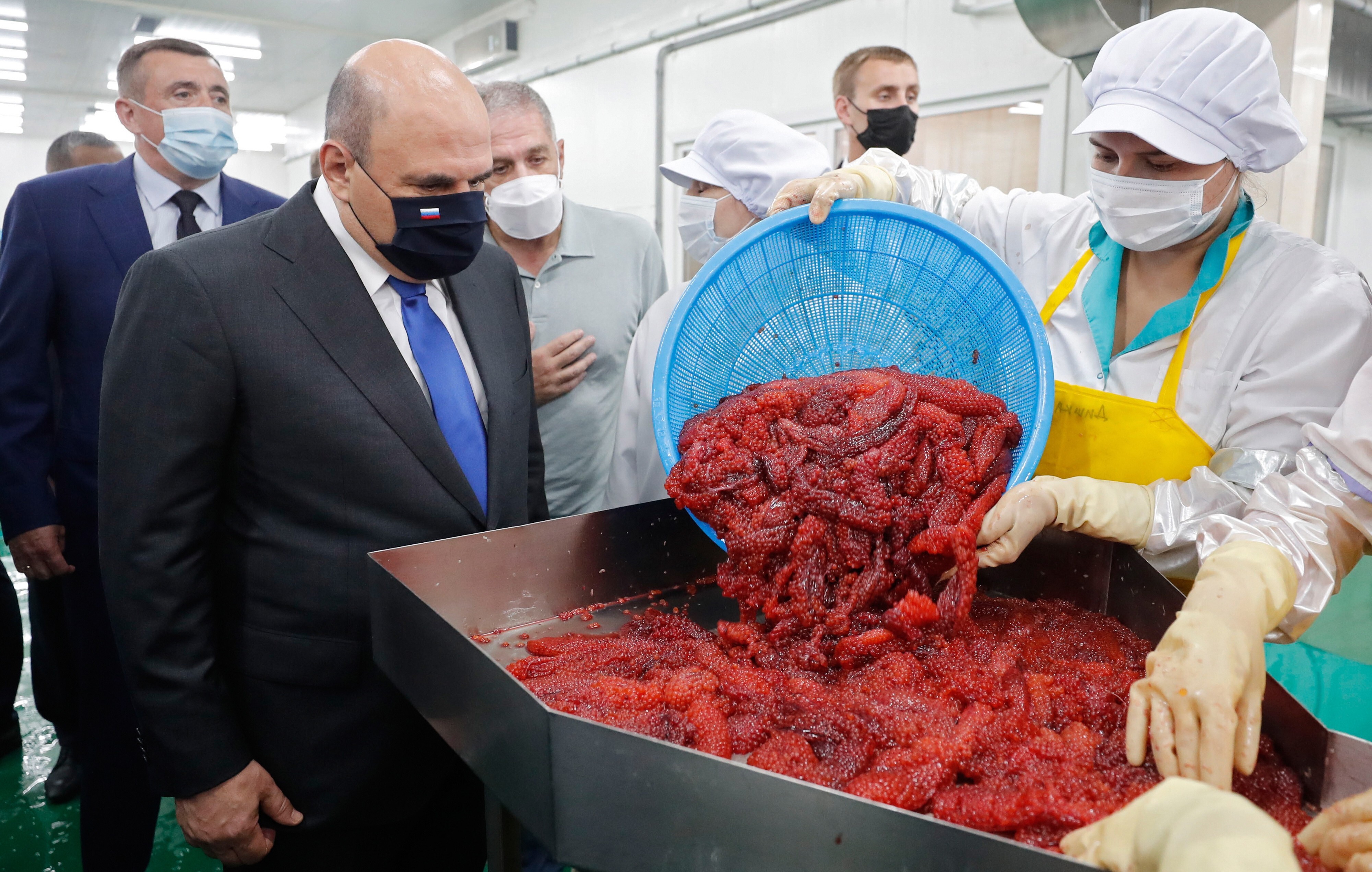 Russian Prime Minister Mikhail Mishustin visits a fish processing factory in Russia’s Kuril Islands on July 26, 2021. Photo: EPA-EFE