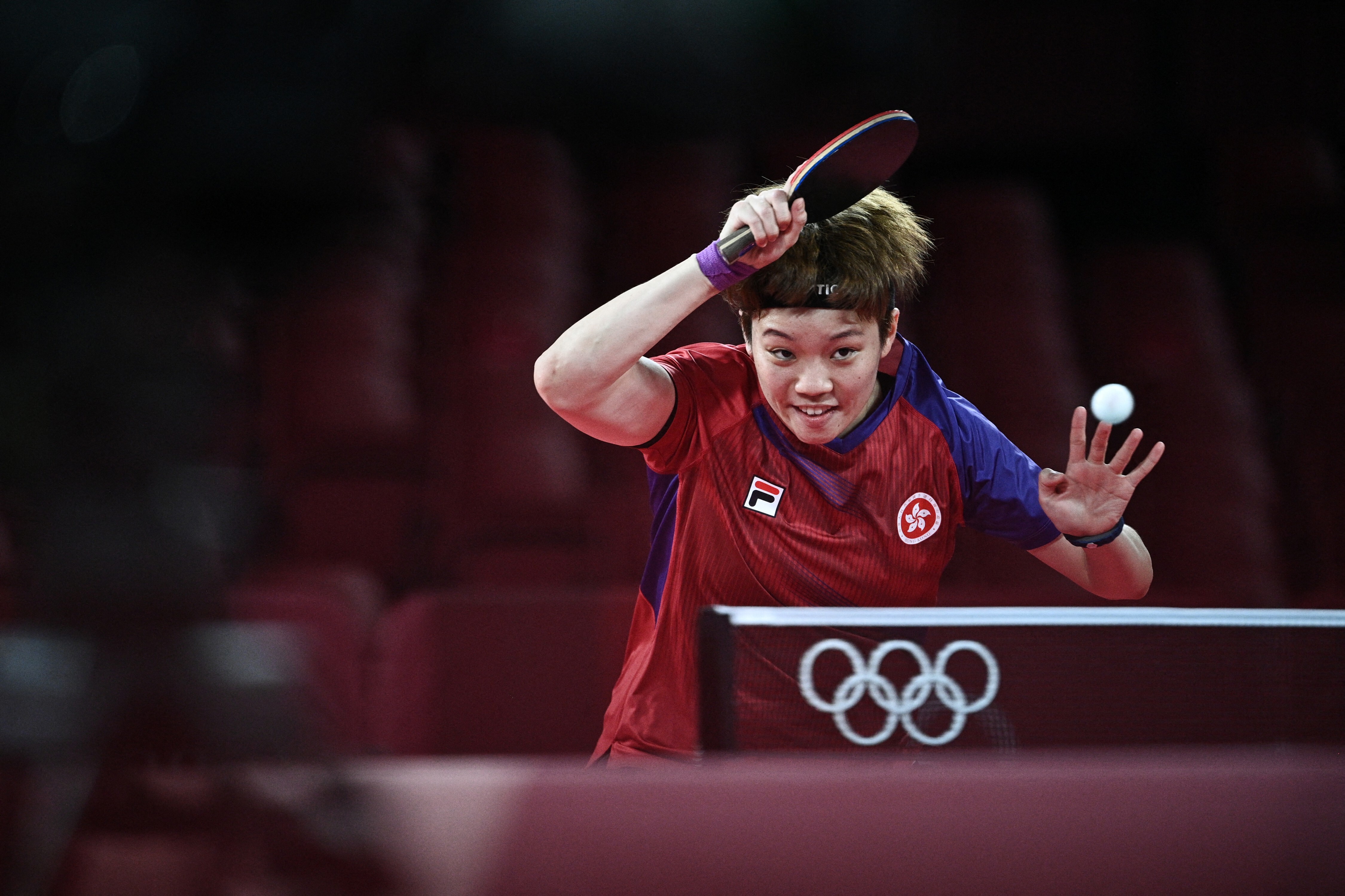 Hong Kong’s Doo Hoi-kem returns against China’s Chen Meng during their table tennis quarter-final match. Photo: AFP