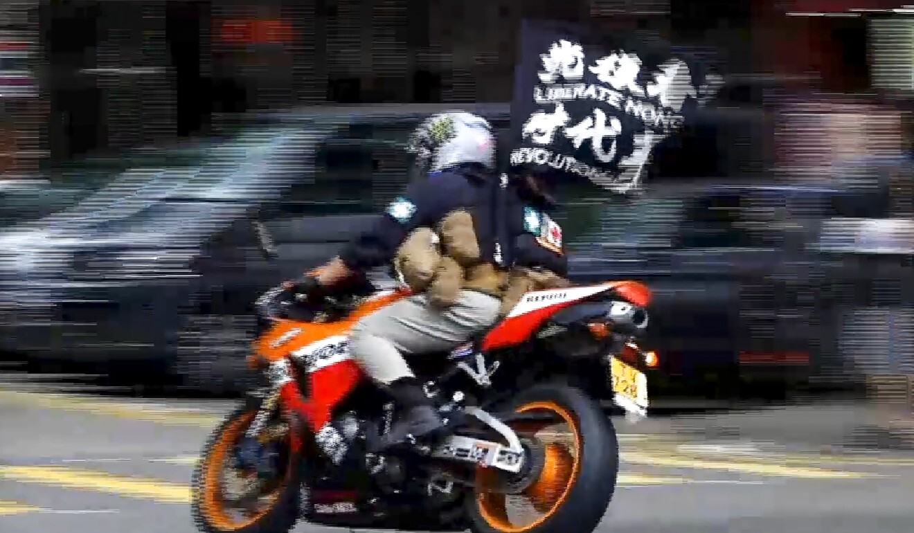 Leon Tong was found guilty of inciting secession for flying a flag with the words ‘Liberate Hong Kong; revolution of our times’ before driving his motorcycle into a group of police. Photo: Cable TV